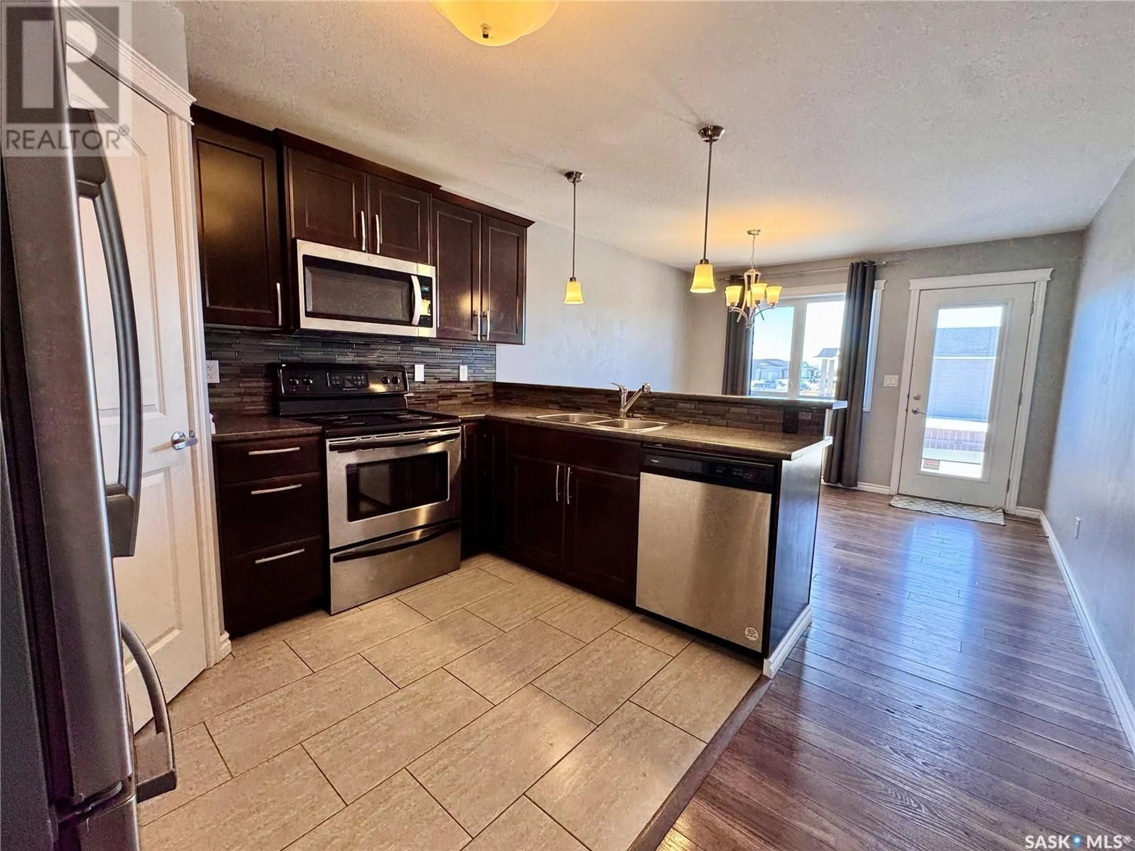 Open concept kitchen, unknown for 106 MARTENS CRESCENT, Warman Saskatchewan S0K4S3
