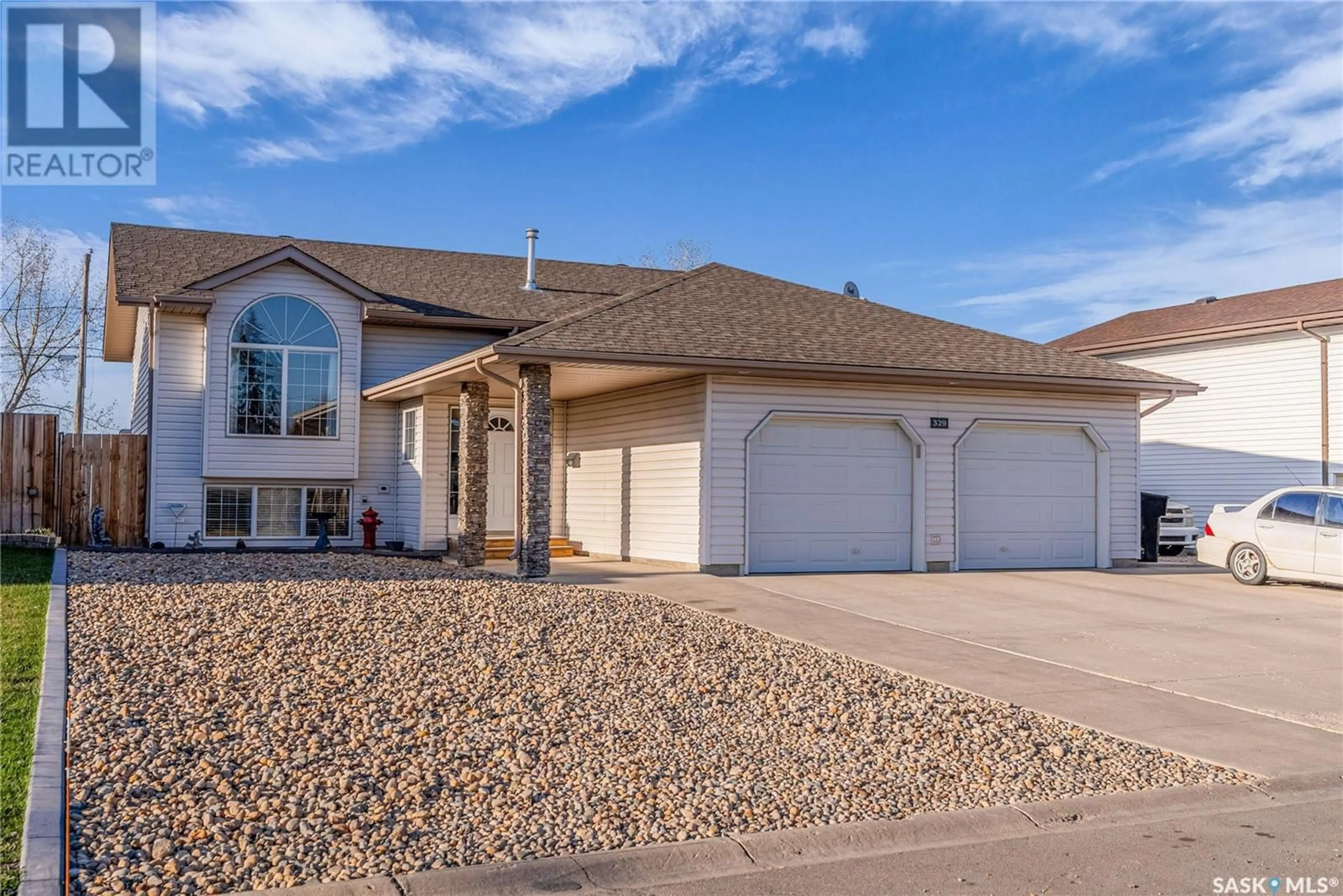 Home with vinyl exterior material, street for 329 5TH STREET, Martensville Saskatchewan S0K2T0