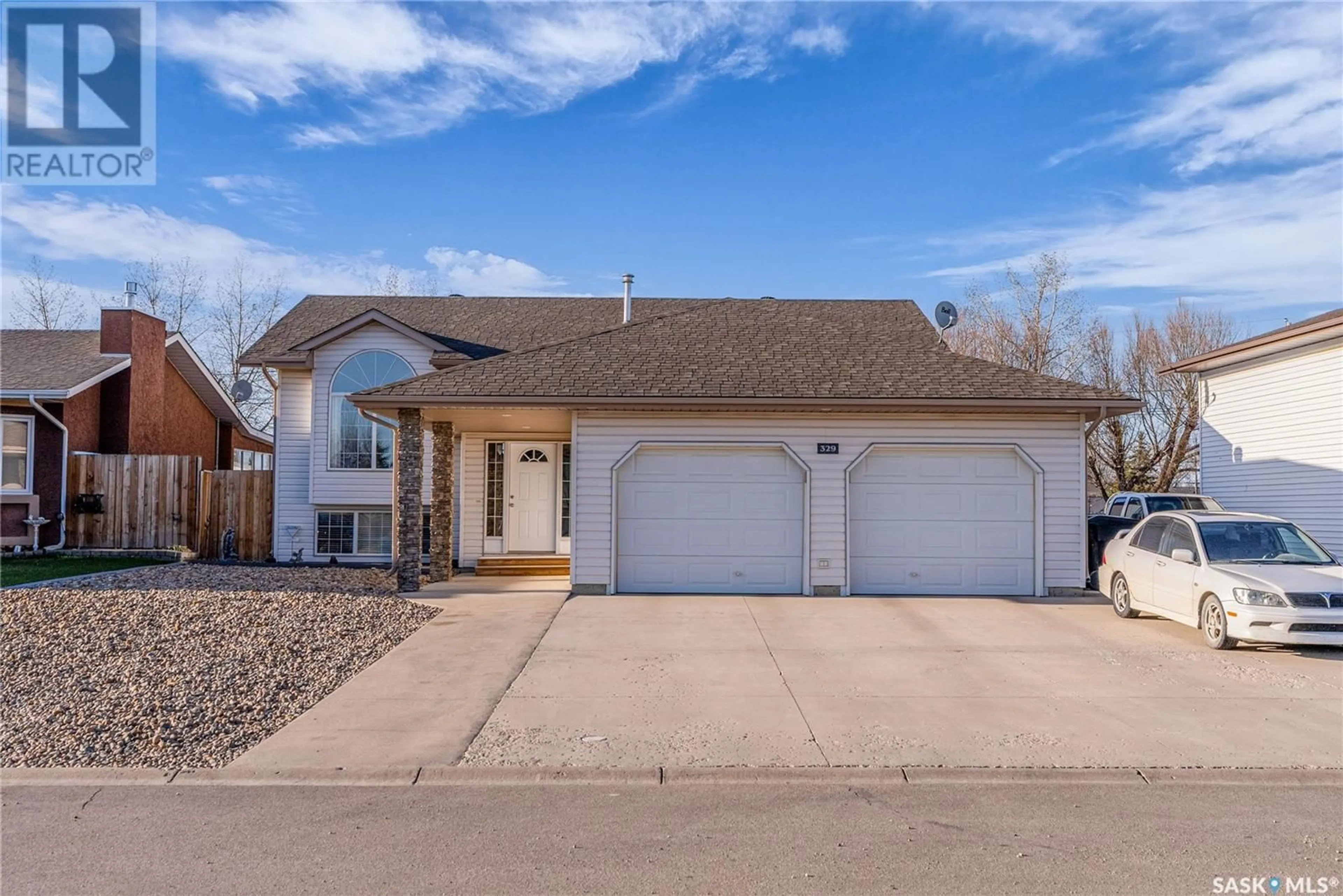 Home with vinyl exterior material, street for 329 5TH STREET, Martensville Saskatchewan S0K2T0