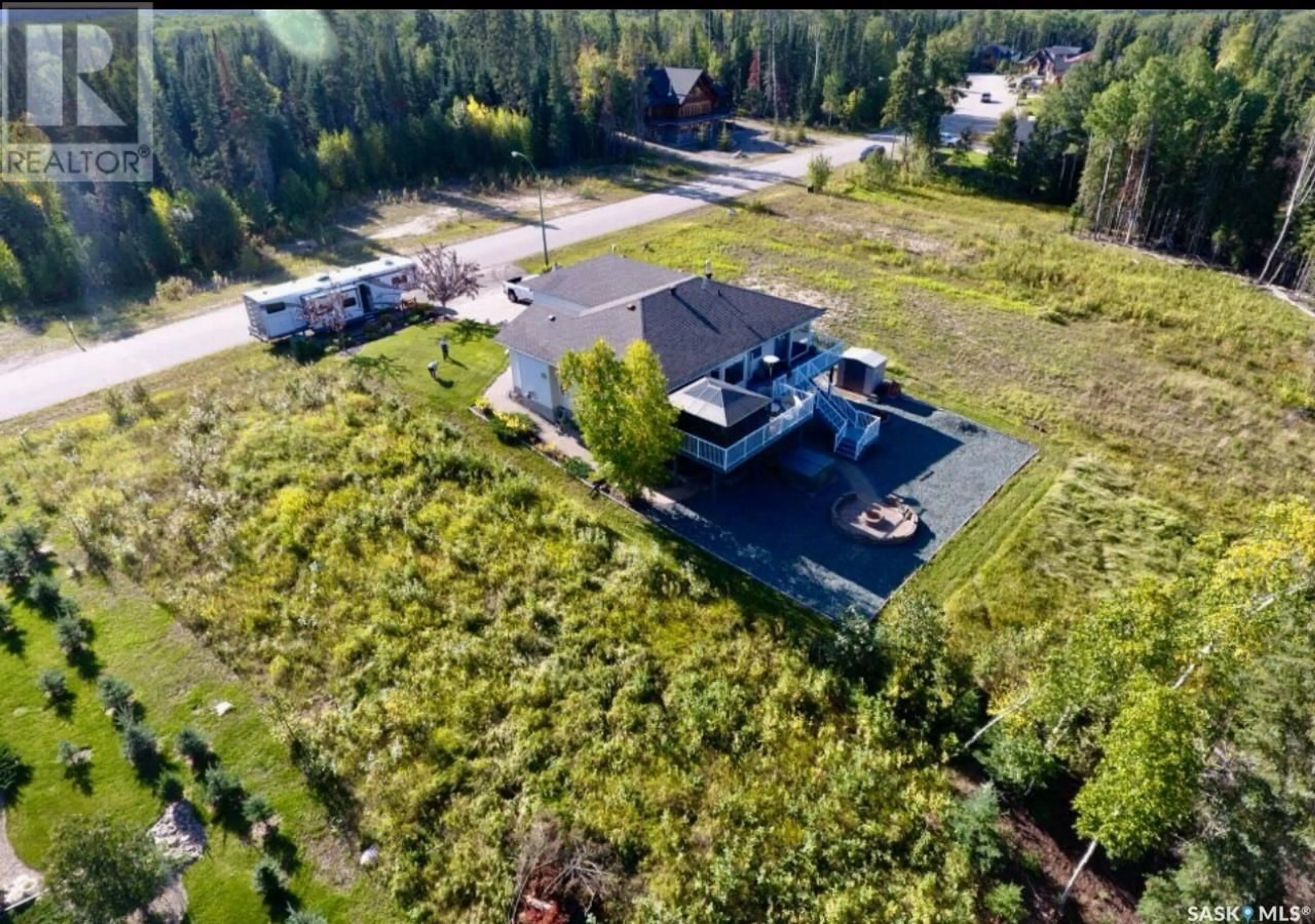 A pic from outside/outdoor area/front of a property/back of a property/a pic from drone, unknown for 67 ESTATES DRIVE, Elk Ridge Saskatchewan S0J0N0