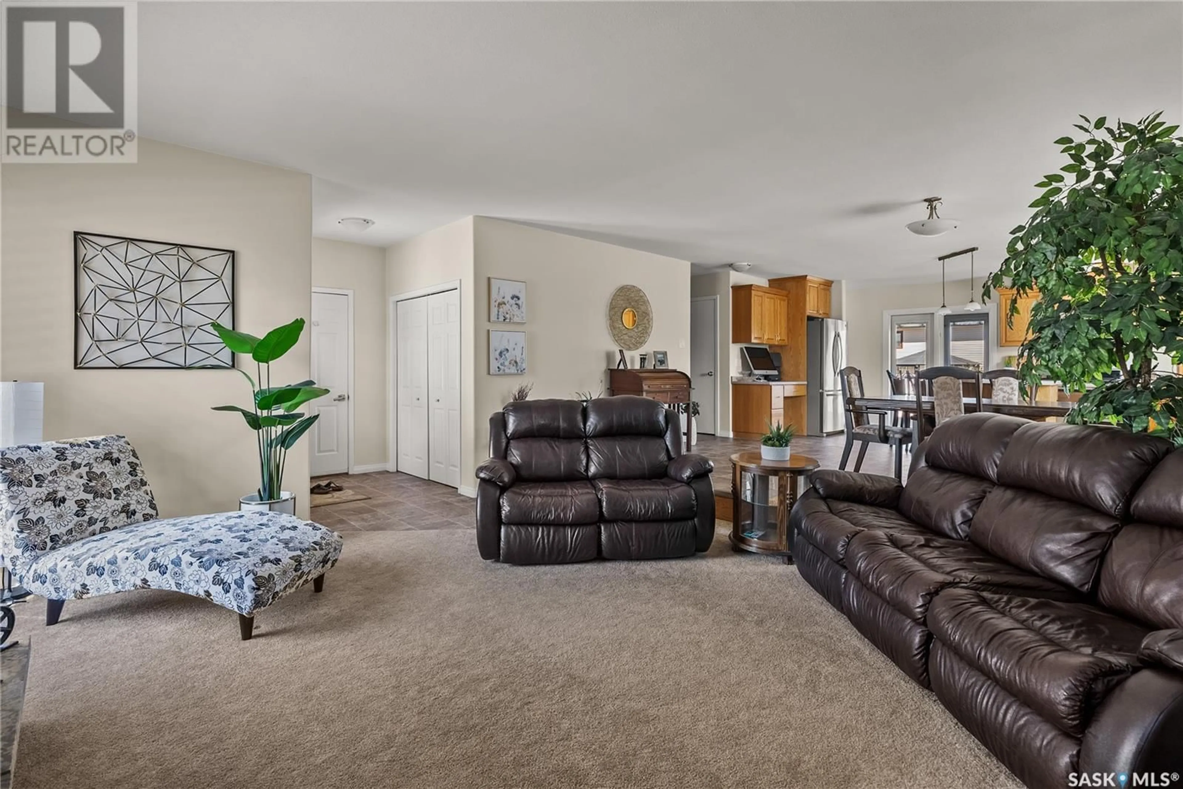 Living room with furniture, carpet floor for 251 SEBESTYEN TERRACE, Saskatoon Saskatchewan S7K6R8