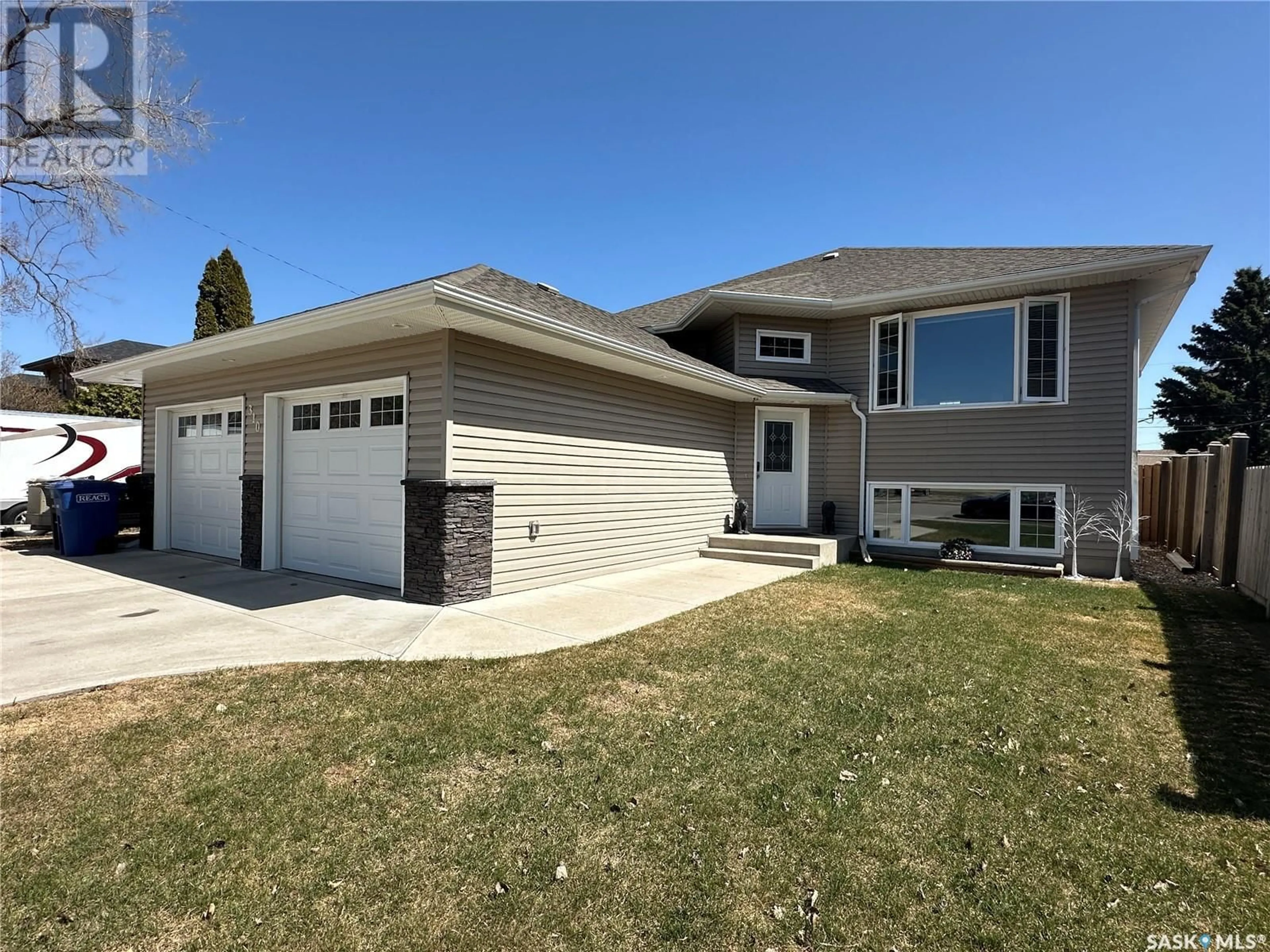 Home with vinyl exterior material, street for 310 6TH STREET, Humboldt Saskatchewan S0K2A0