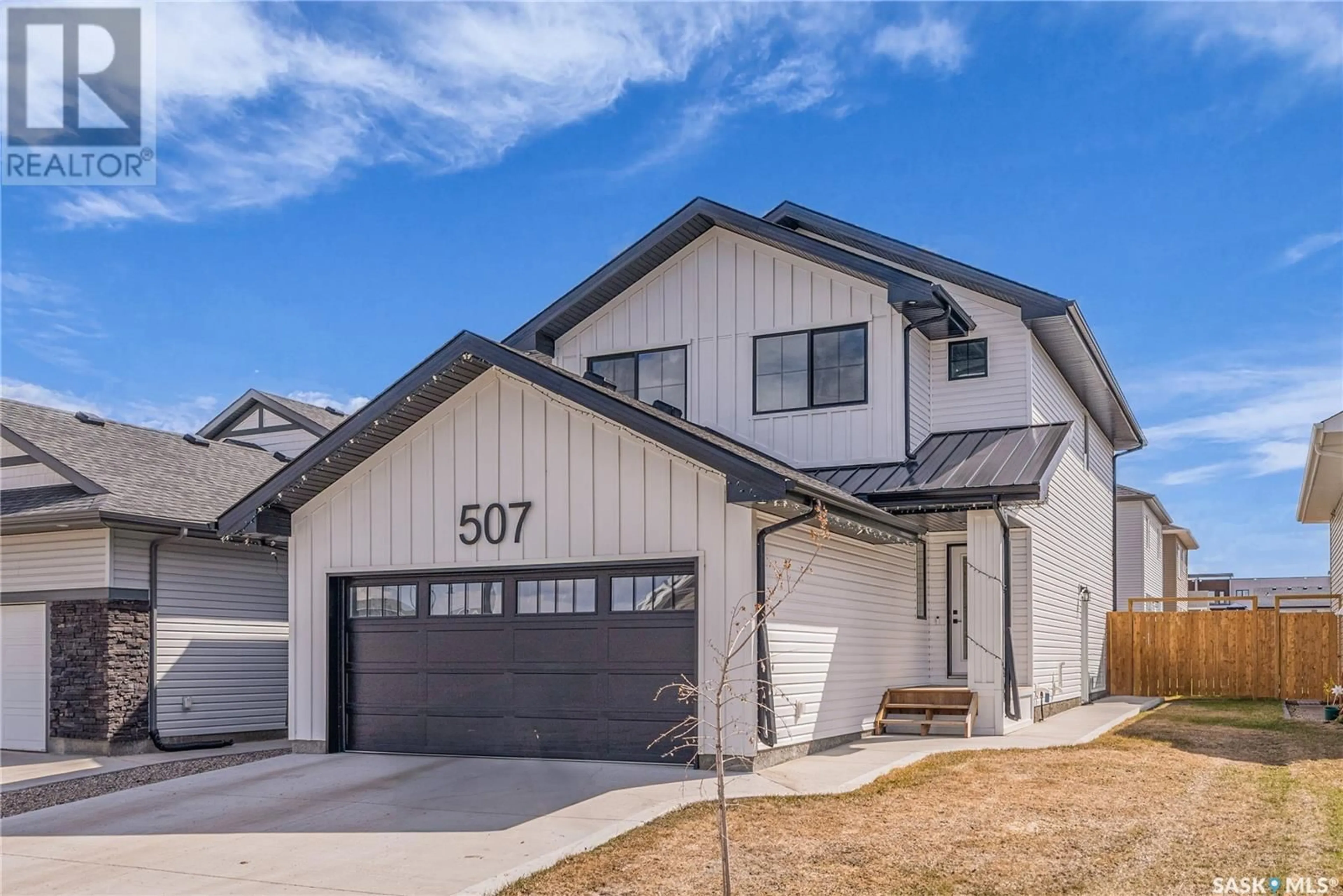 Home with vinyl exterior material, street for 507 KENSINGTON PLACE, Saskatoon Saskatchewan S7L6N7
