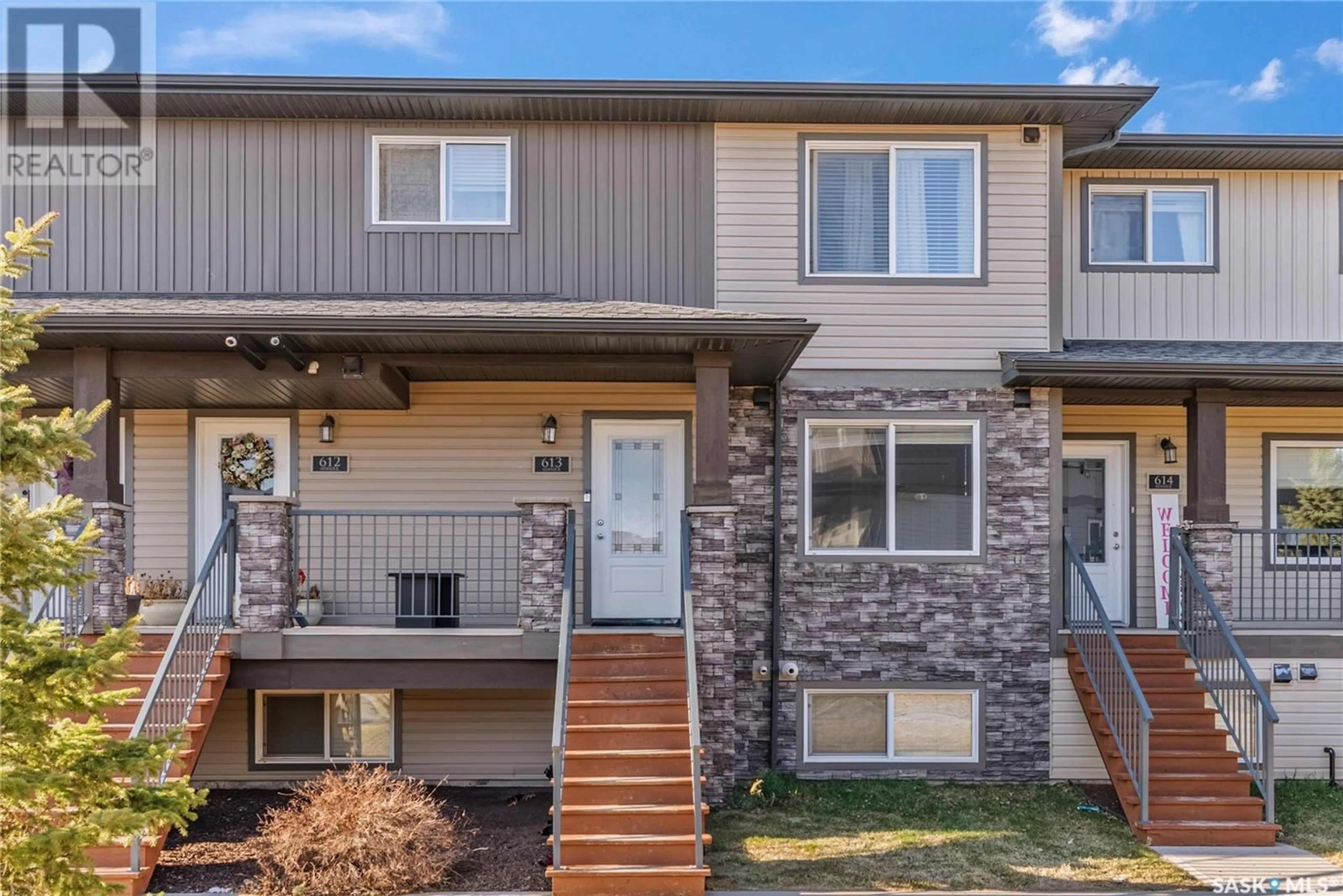 Home with vinyl exterior material, street for 210 - 613 RAJPUT WAY, Saskatoon Saskatchewan S7W0V7