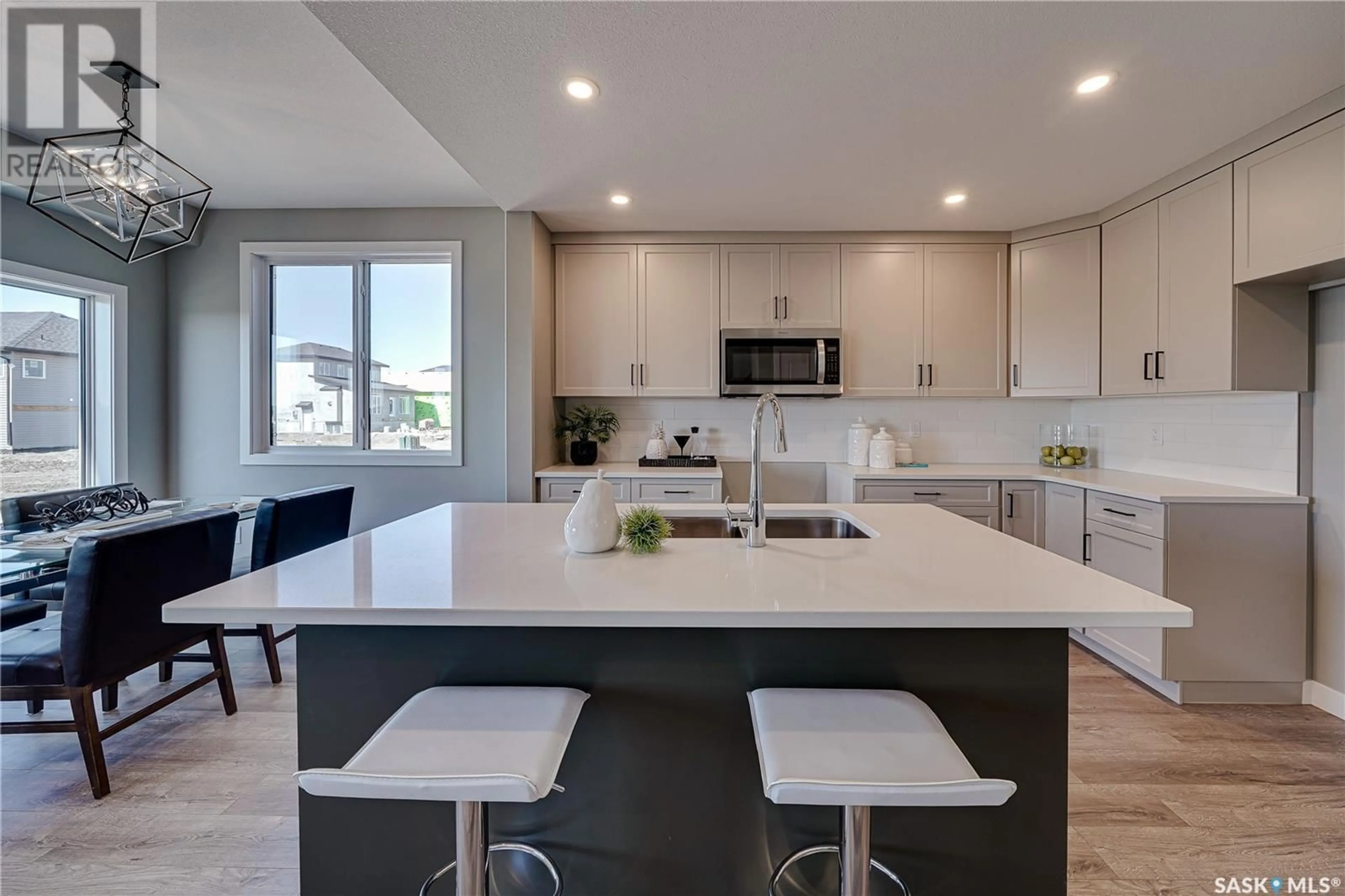 Open concept kitchen, ceramic/tile floor for 202 ANTONINI COURT, Saskatoon Saskatchewan S7L7P3