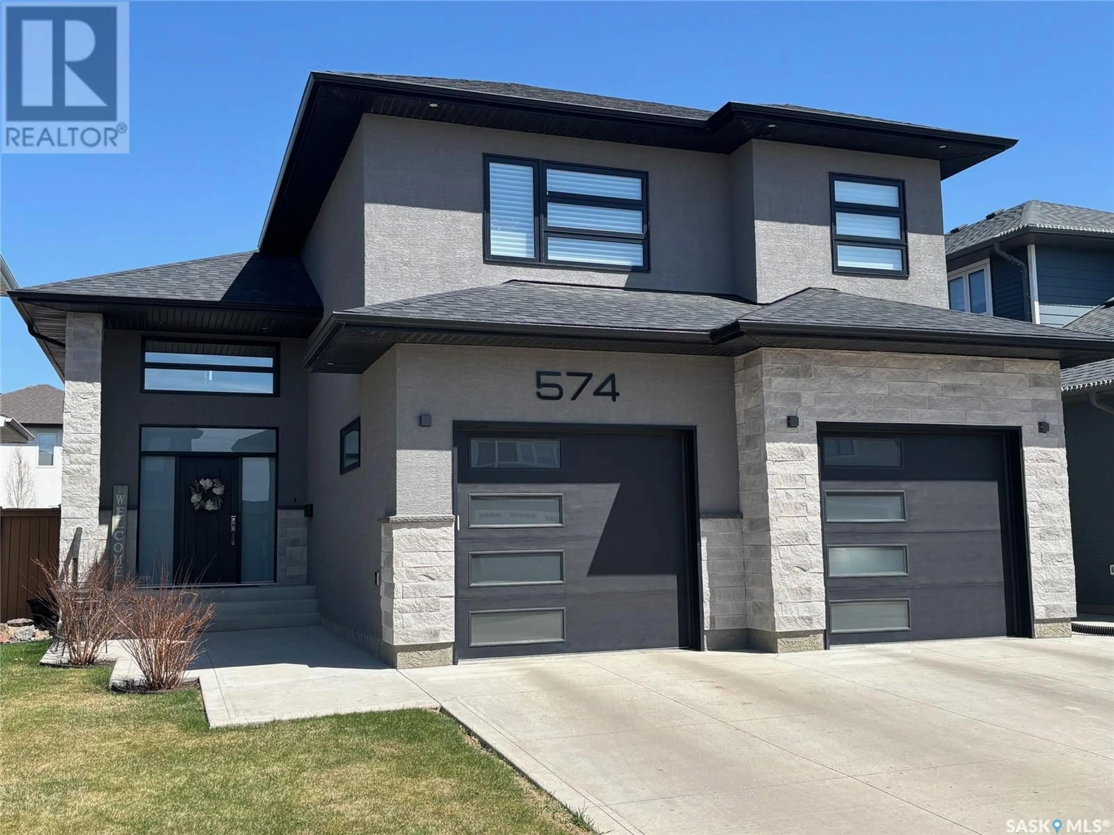 Home with brick exterior material, street for 574 BOLSTAD TURN, Saskatoon Saskatchewan S7W0X9