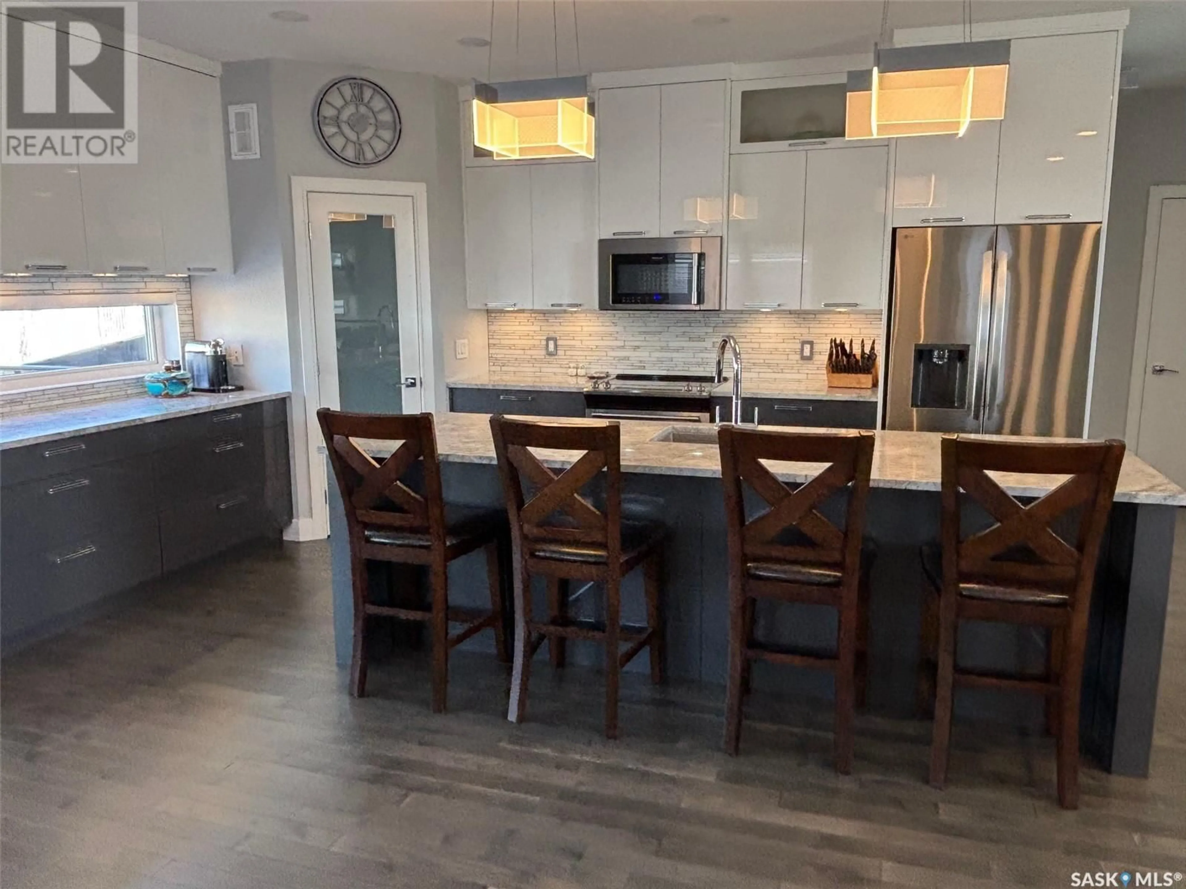Open concept kitchen, wood/laminate floor for 574 BOLSTAD TURN, Saskatoon Saskatchewan S7W0X9