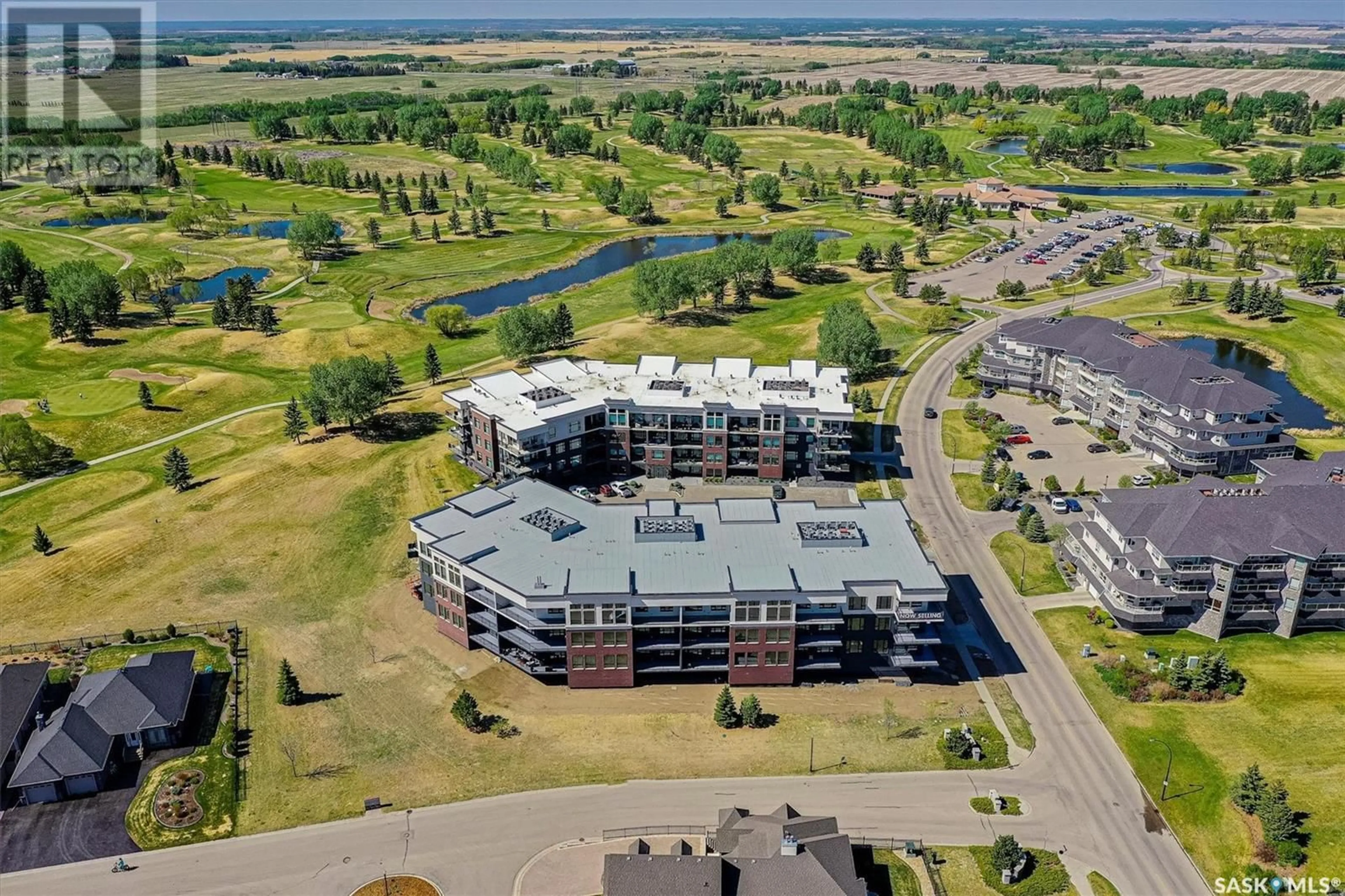 A pic from outside/outdoor area/front of a property/back of a property/a pic from drone, water/lake/river/ocean view for 408 - 313 CARTWRIGHT STREET, Saskatoon Saskatchewan S7T0X1