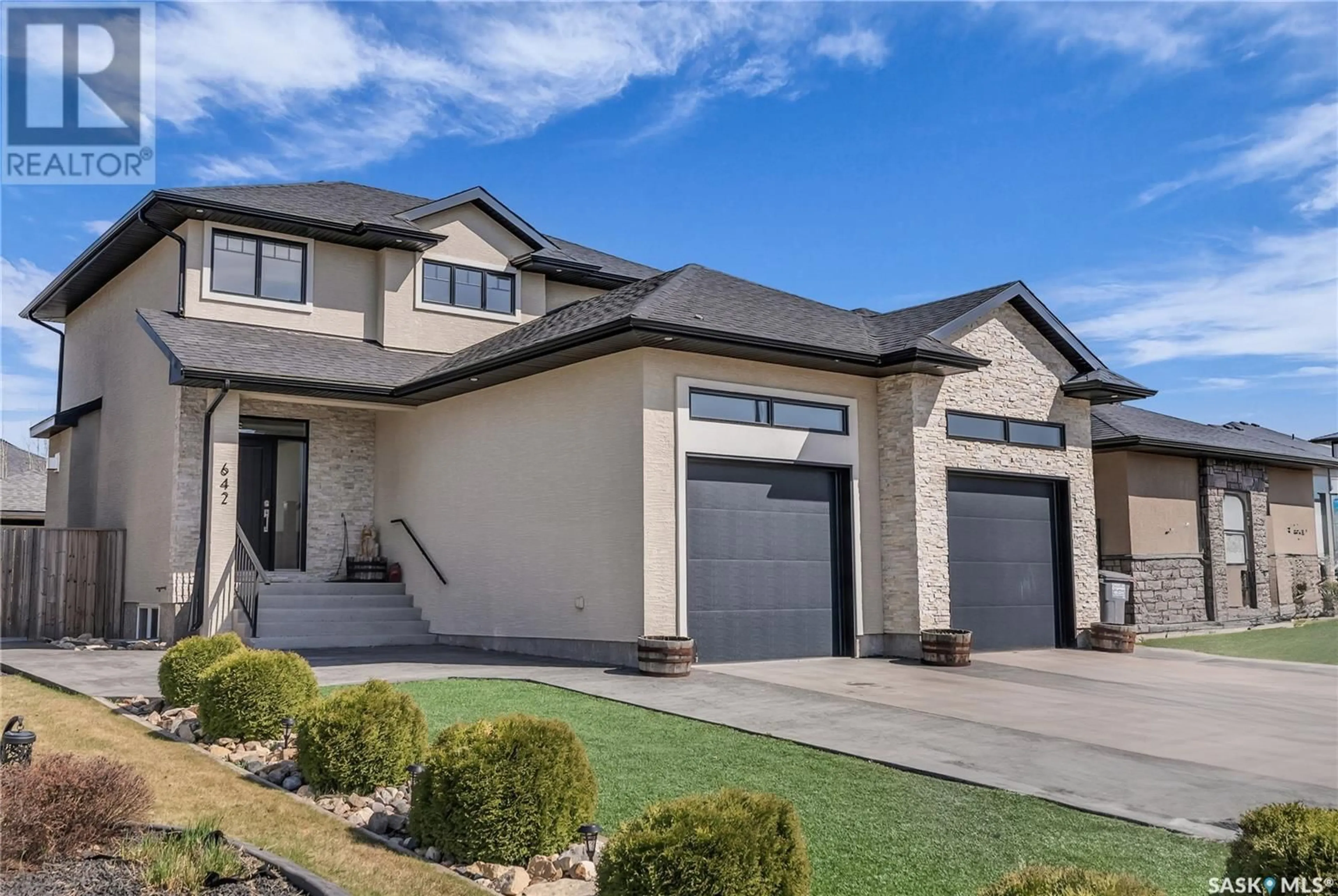 Home with vinyl exterior material, street for 642 KLOPPENBURG TERRACE, Saskatoon Saskatchewan S7W0P1