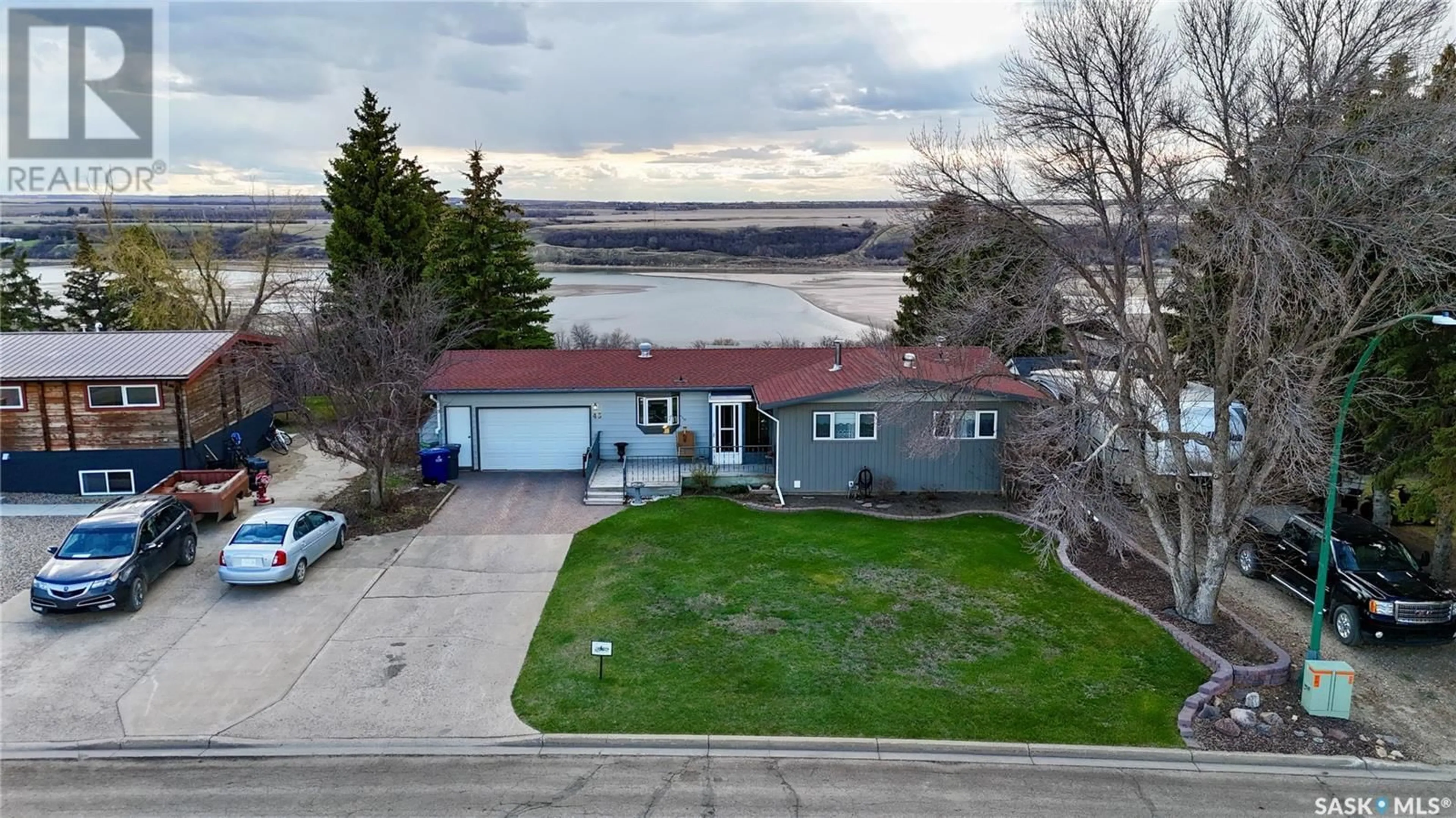 A pic from outside/outdoor area/front of a property/back of a property/a pic from drone, water/lake/river/ocean view for 45 TUFTS CRESCENT, Outlook Saskatchewan S0L2N0