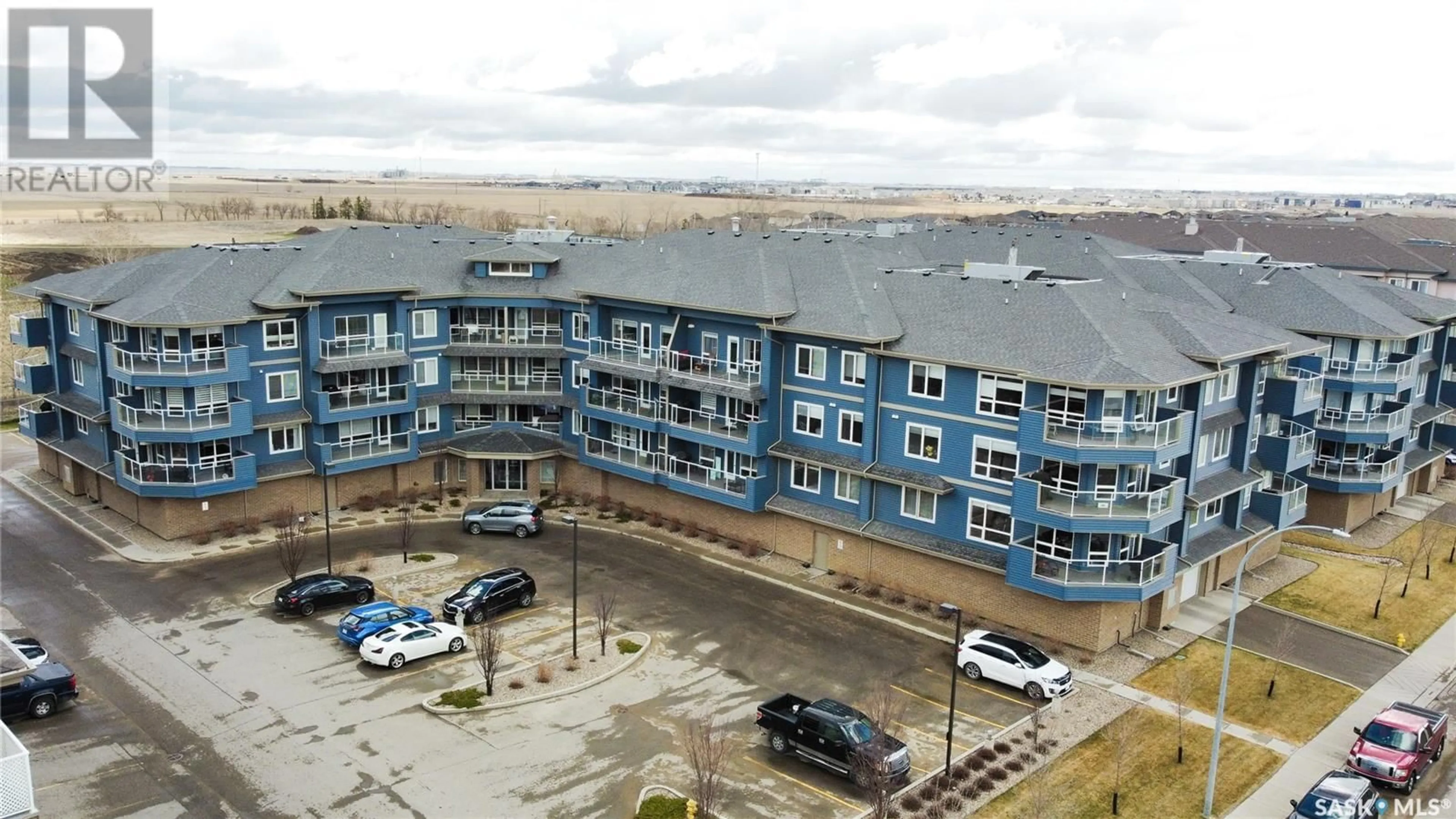 A pic from outside/outdoor area/front of a property/back of a property/a pic from drone, building for 107 - 2321 WINDSOR PARK ROAD, Regina Saskatchewan S4V3N2