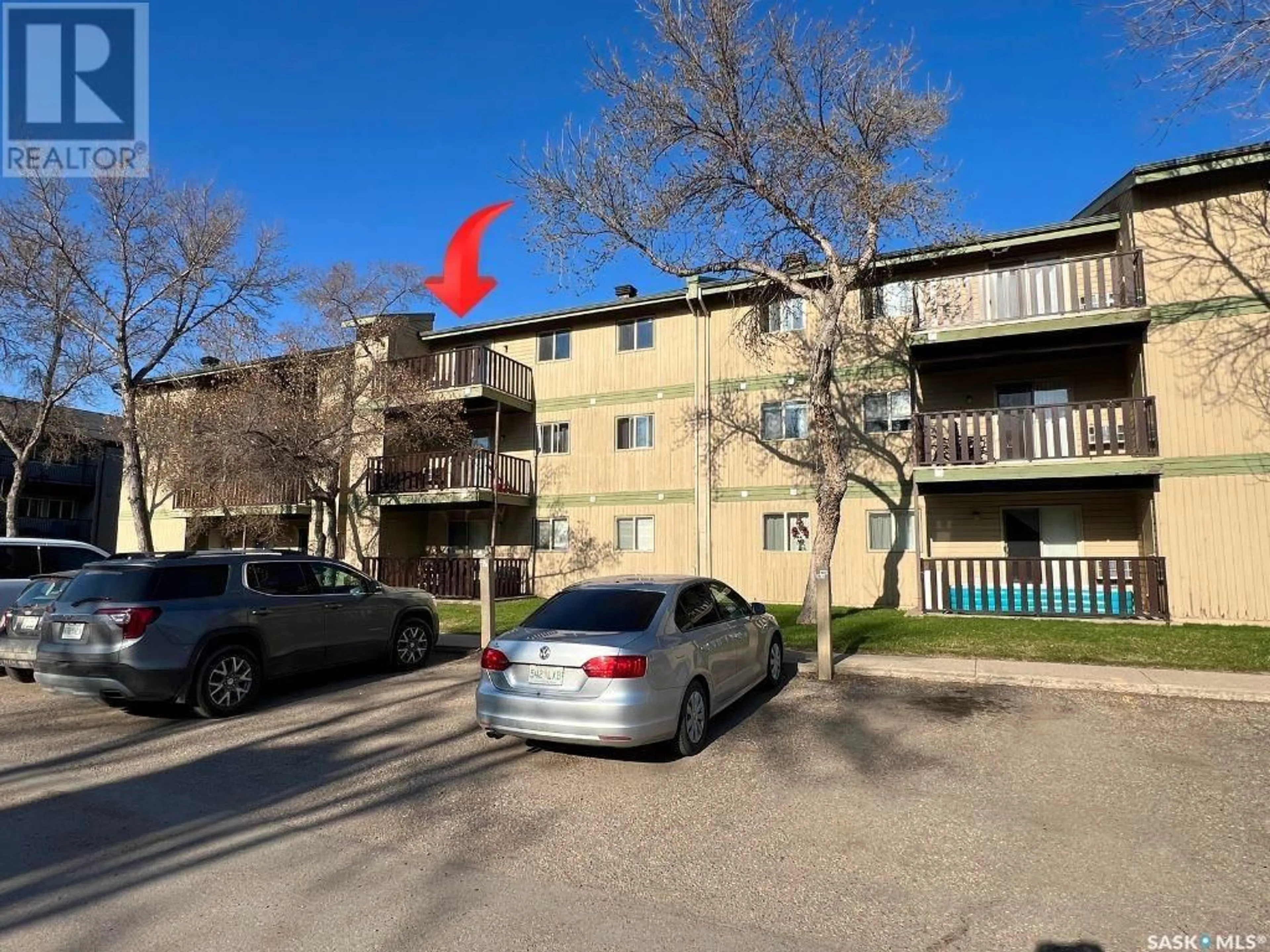 A pic from outside/outdoor area/front of a property/back of a property/a pic from drone, street for 306F - 1121 MCKERCHER DRIVE, Saskatoon Saskatchewan S7H5B8