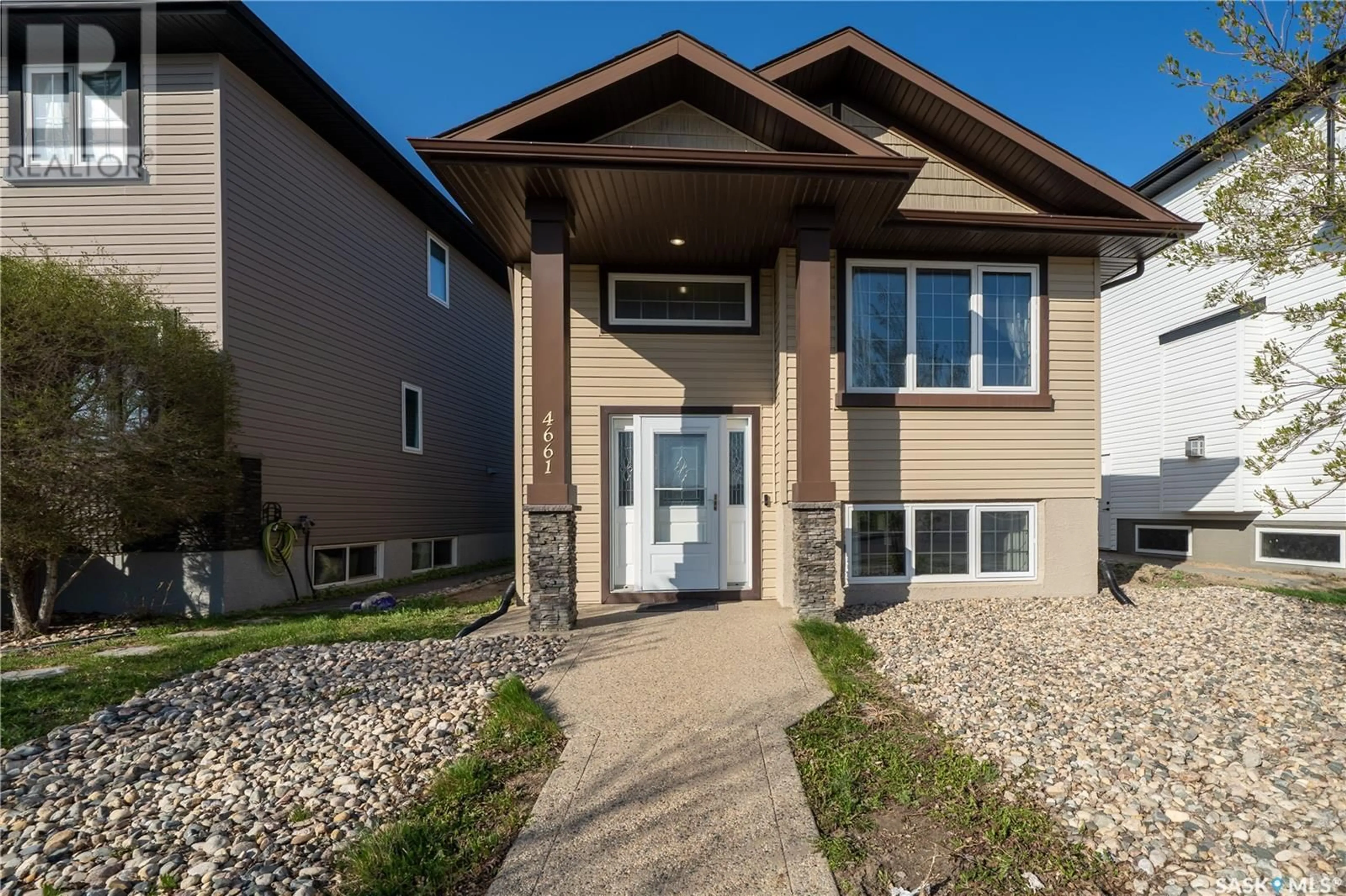 Home with vinyl exterior material, street for 4661 JAMES HILL ROAD, Regina Saskatchewan S4W0C7