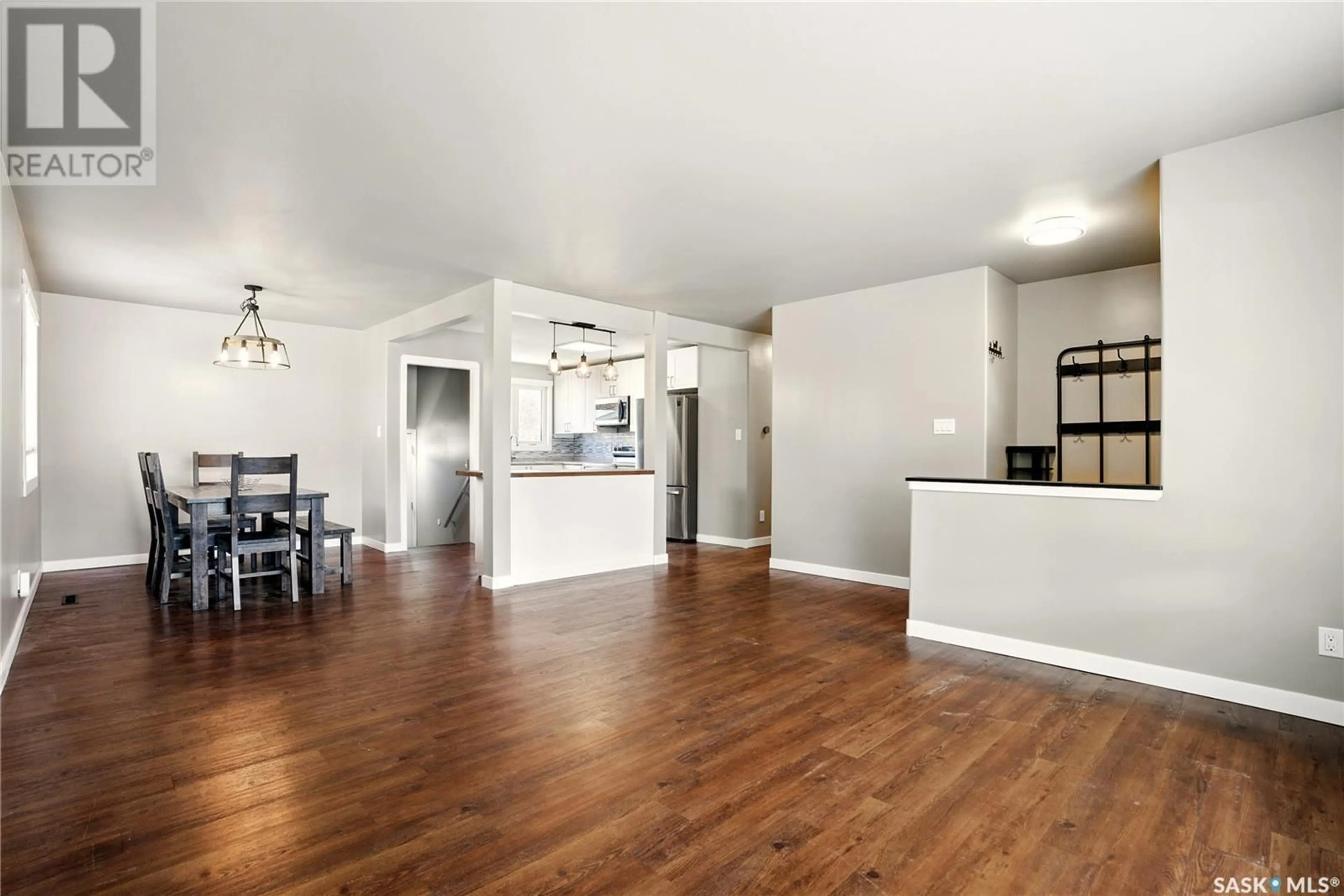 Open concept kitchen, wood/laminate floor for 2811 IRVINE AVENUE, Saskatoon Saskatchewan S7J2B4