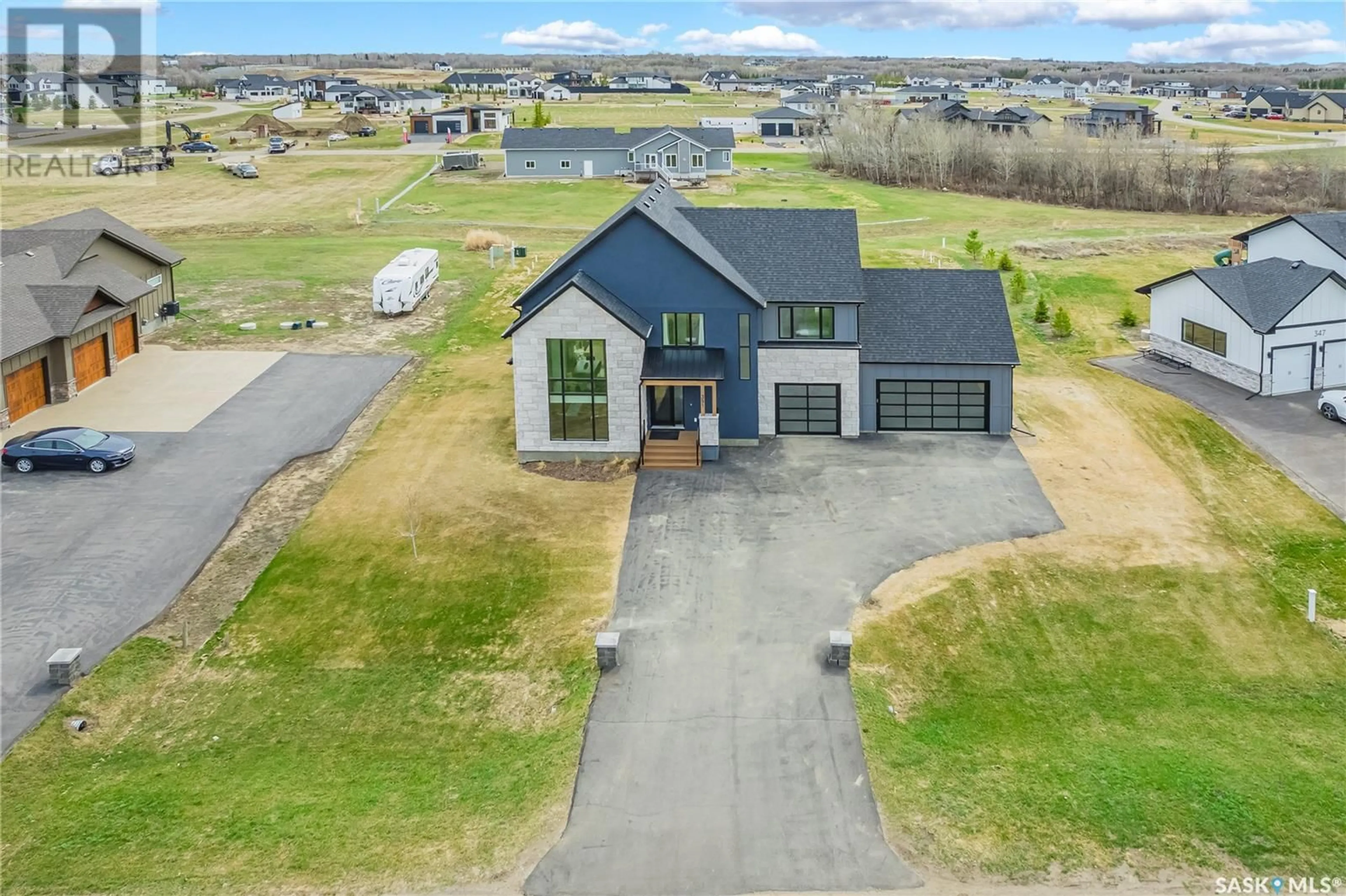 A pic from outside/outdoor area/front of a property/back of a property/a pic from drone, street for 351 EDGEMONT CRESCENT, Corman Park Rm No. 344 Saskatchewan S7T1A2