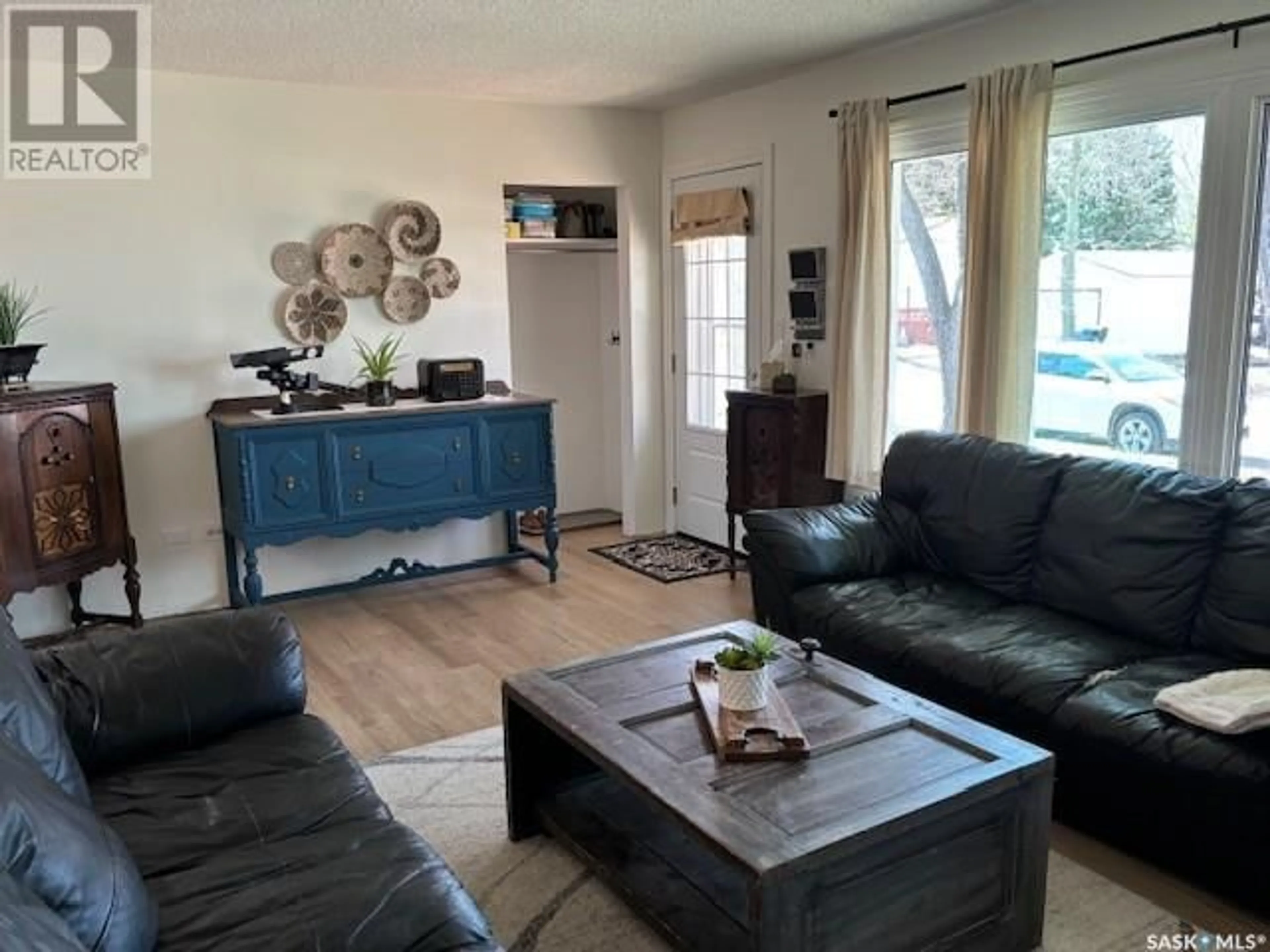 Living room with furniture, wood/laminate floor for 122 MARY STREET, Canora Saskatchewan S0A0L0