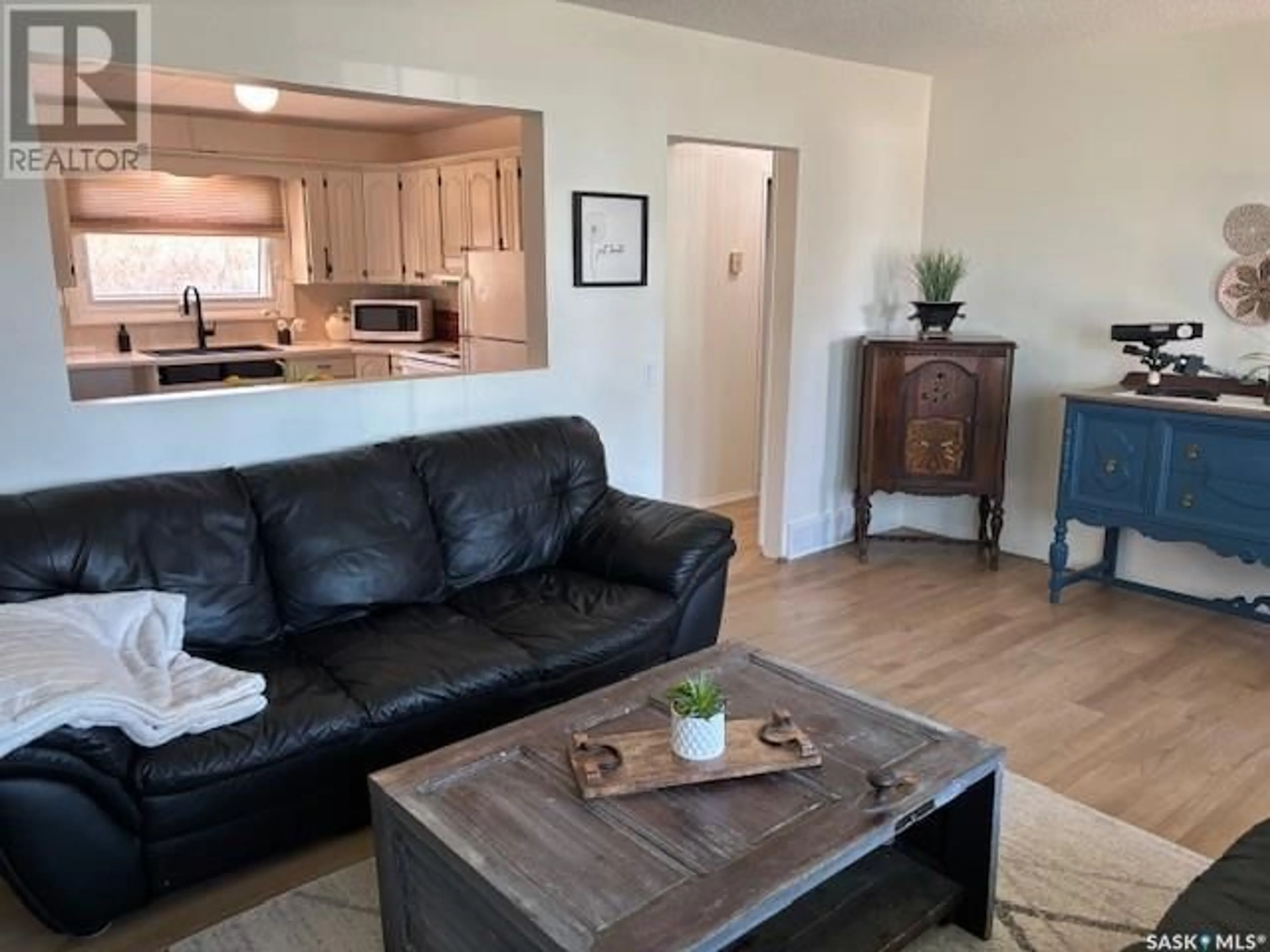 Living room with furniture, wood/laminate floor for 122 MARY STREET, Canora Saskatchewan S0A0L0