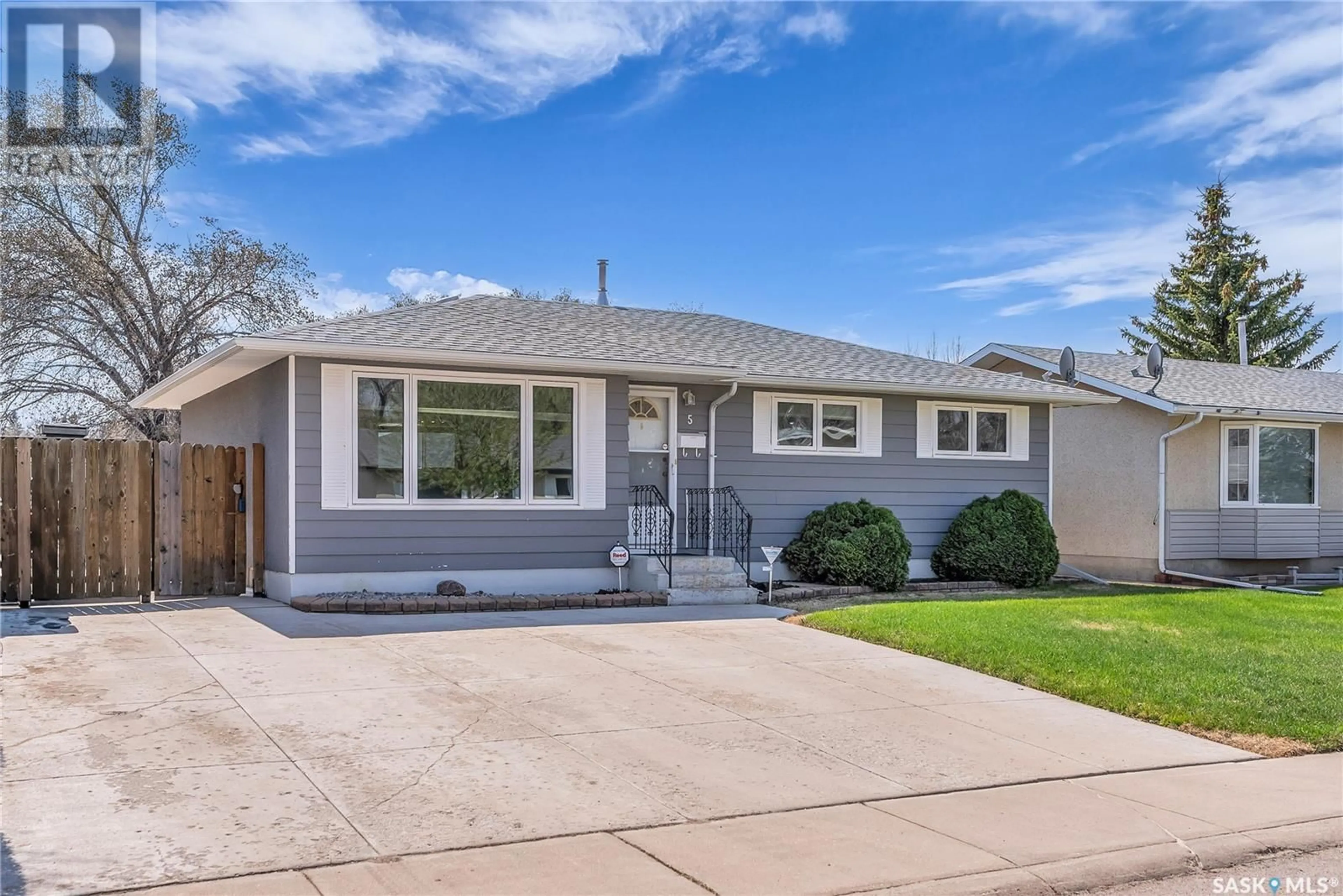 Home with vinyl exterior material, street for 5 NICHOLSON PLACE, Saskatoon Saskatchewan S7L4G7