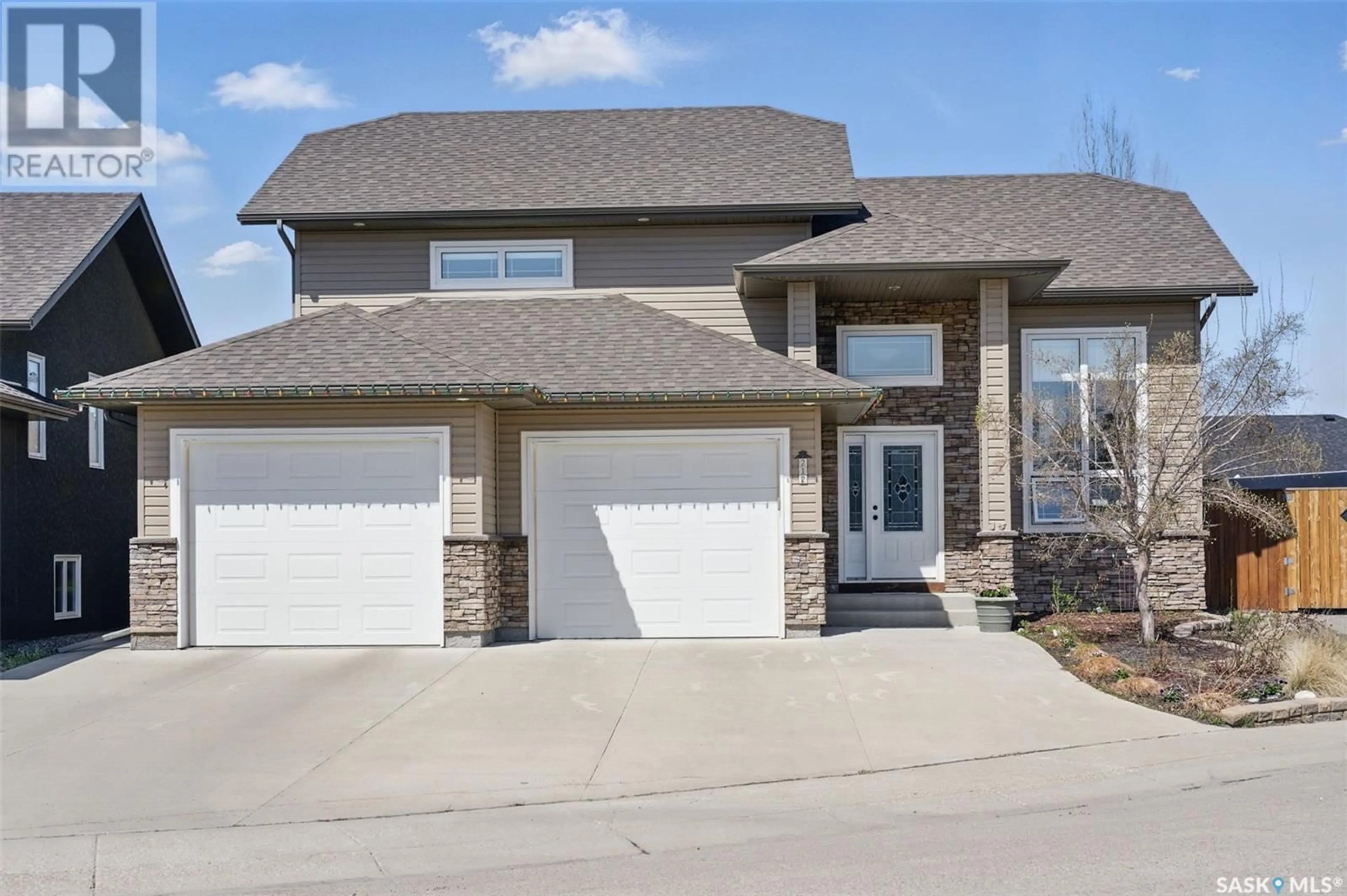 Home with brick exterior material, street for 212 MIZE PLACE, Warman Saskatchewan S0K4S1