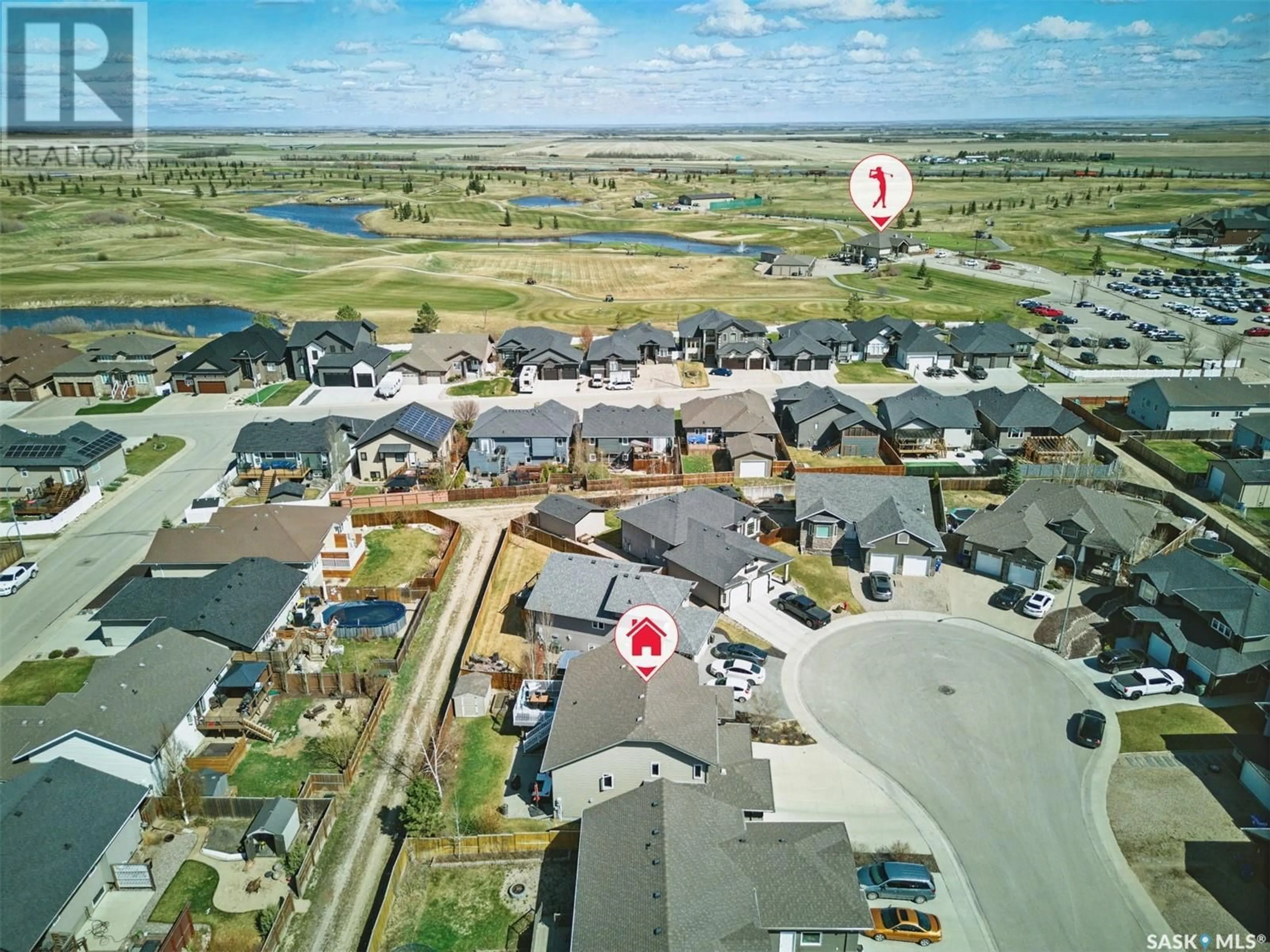 A pic from outside/outdoor area/front of a property/back of a property/a pic from drone, water/lake/river/ocean view for 212 MIZE PLACE, Warman Saskatchewan S0K4S1