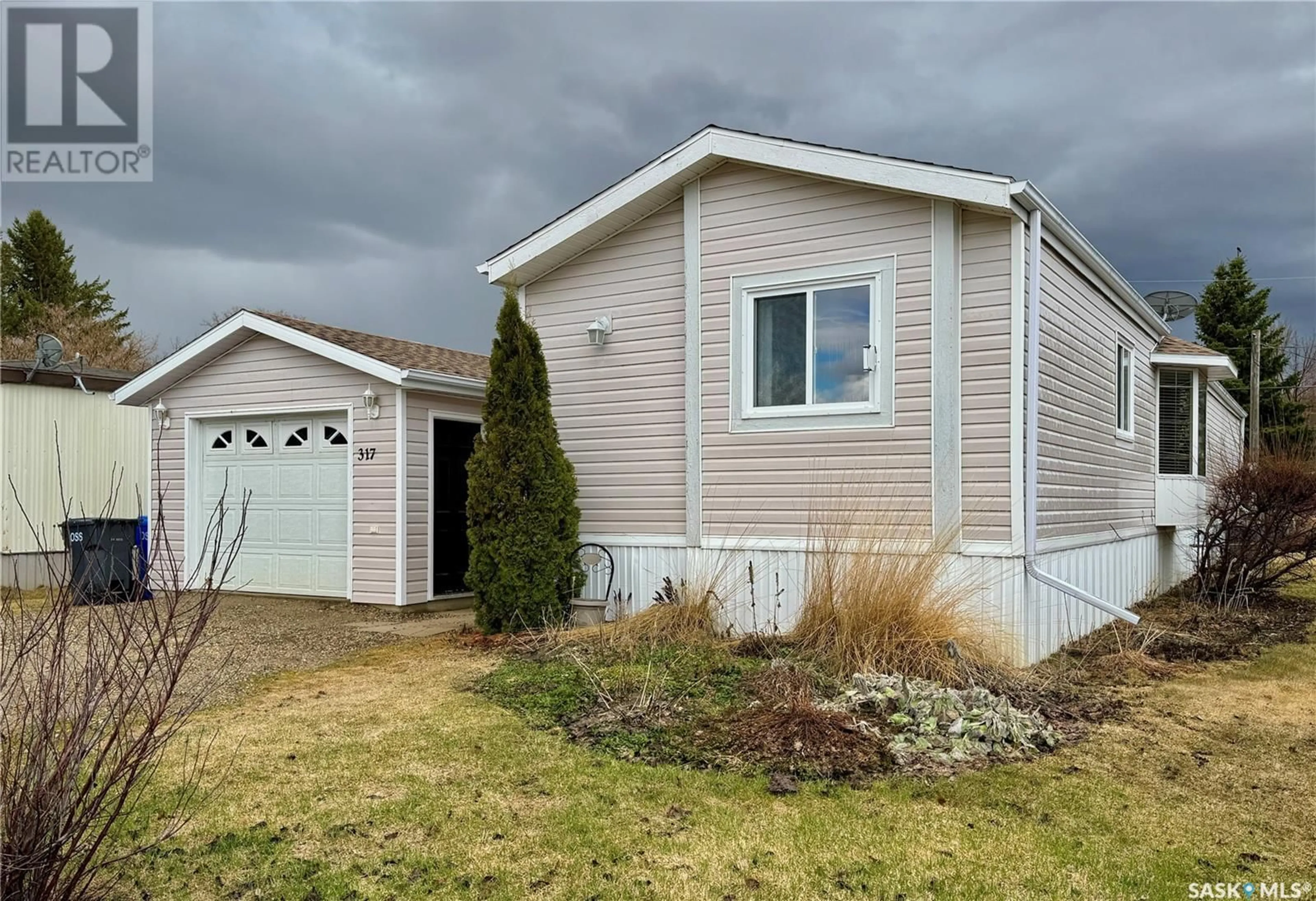 Home with vinyl exterior material, street for E - 317 RIEDEL AVENUE, Langenburg Saskatchewan S0A2A0