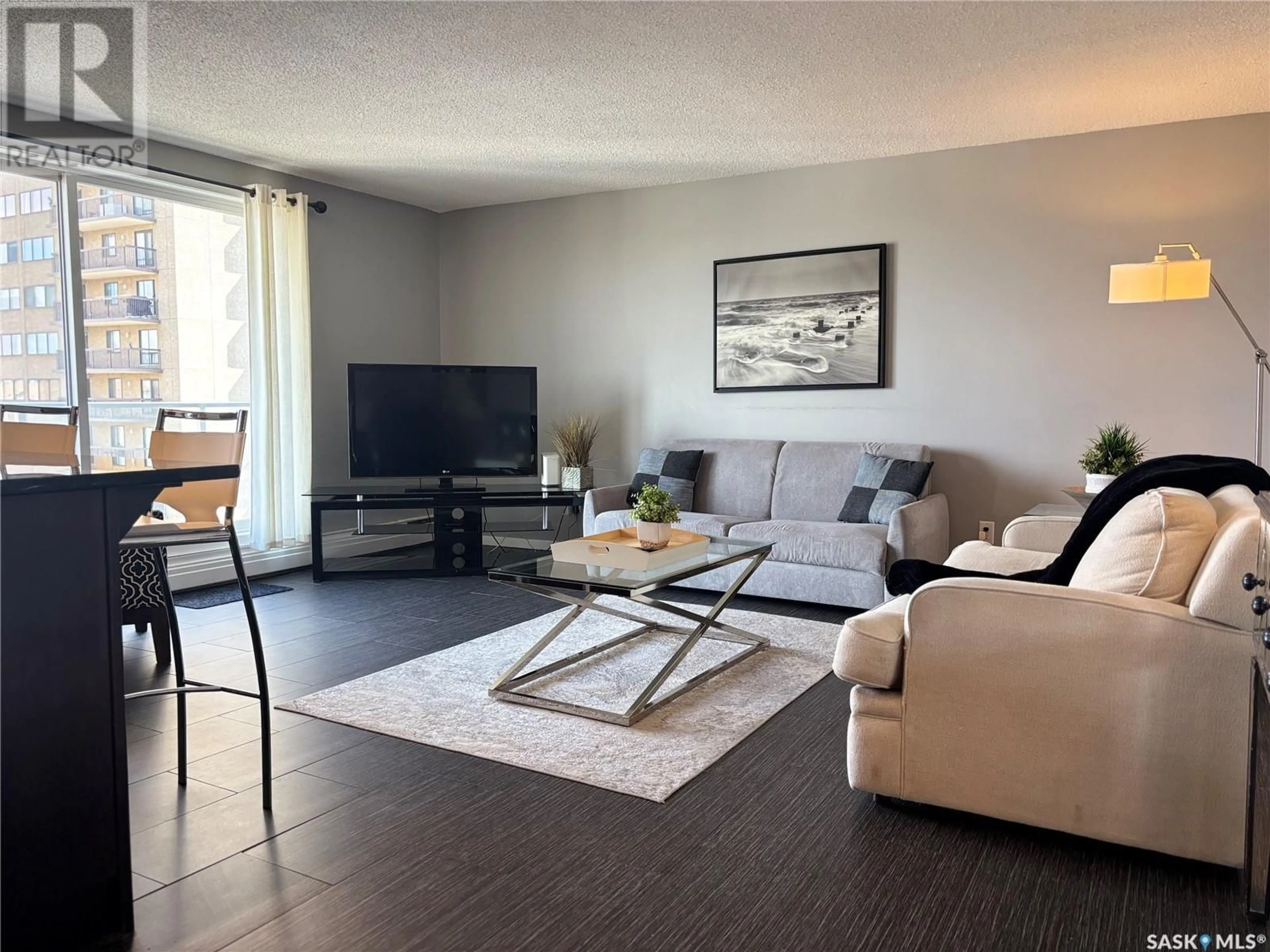 Living room with furniture, wood/laminate floor for N - 1504 320 5TH AVENUE, Saskatoon Saskatchewan S7K2P5