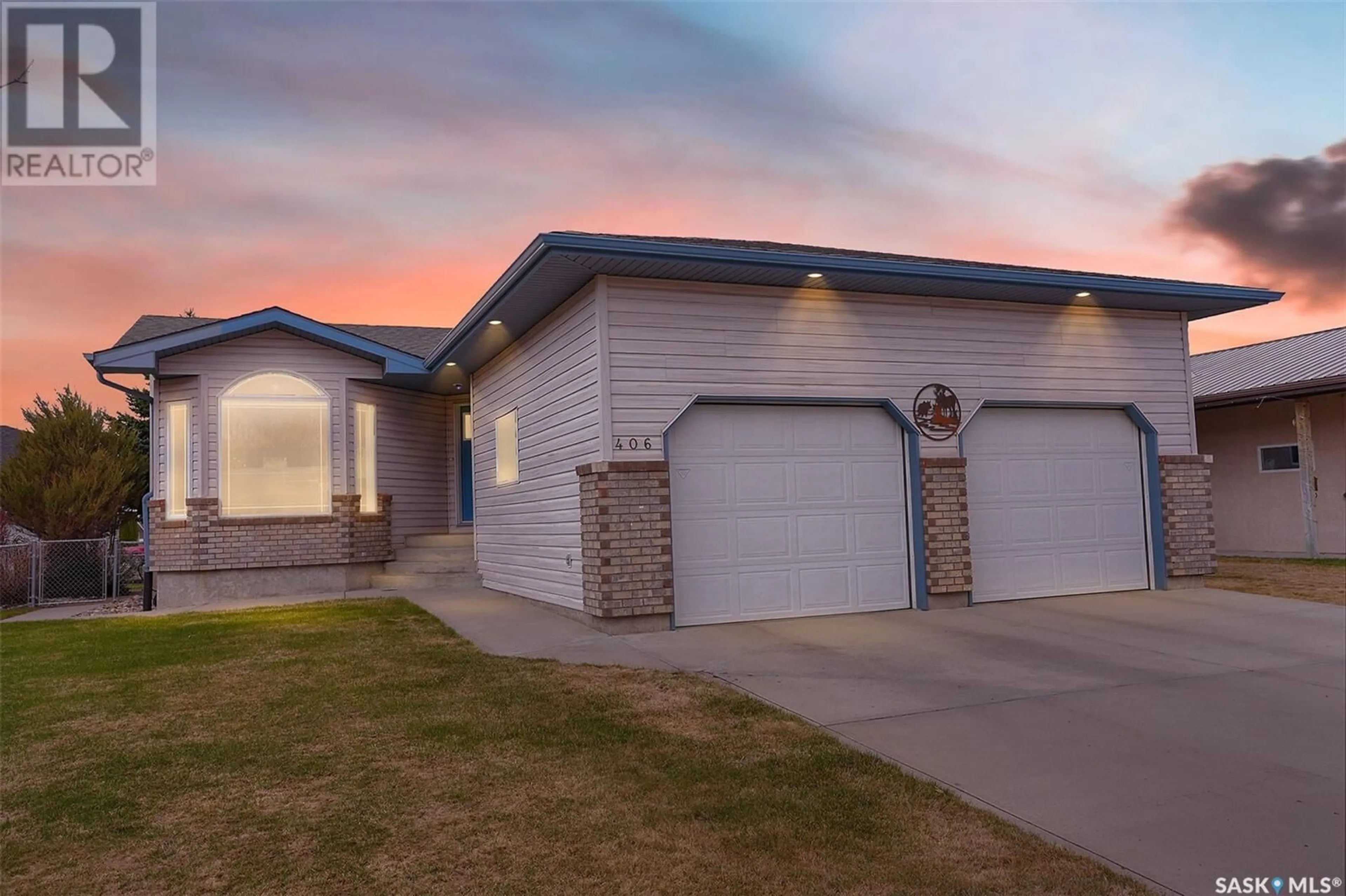 Home with vinyl exterior material, street for 406 HAWKES STREET, Balgonie Saskatchewan S0G0E0