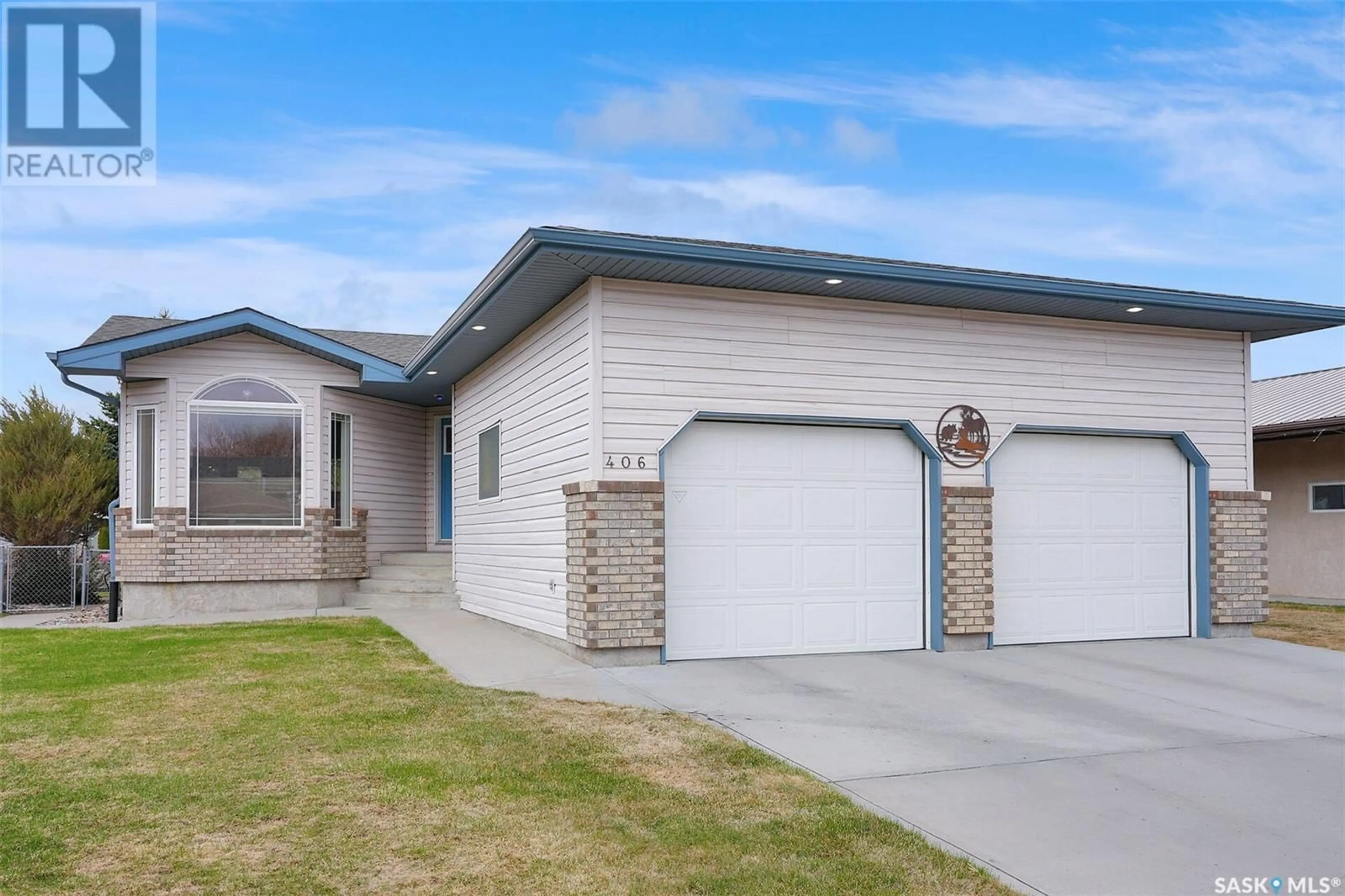 Home with vinyl exterior material, street for 406 HAWKES STREET, Balgonie Saskatchewan S0G0E0