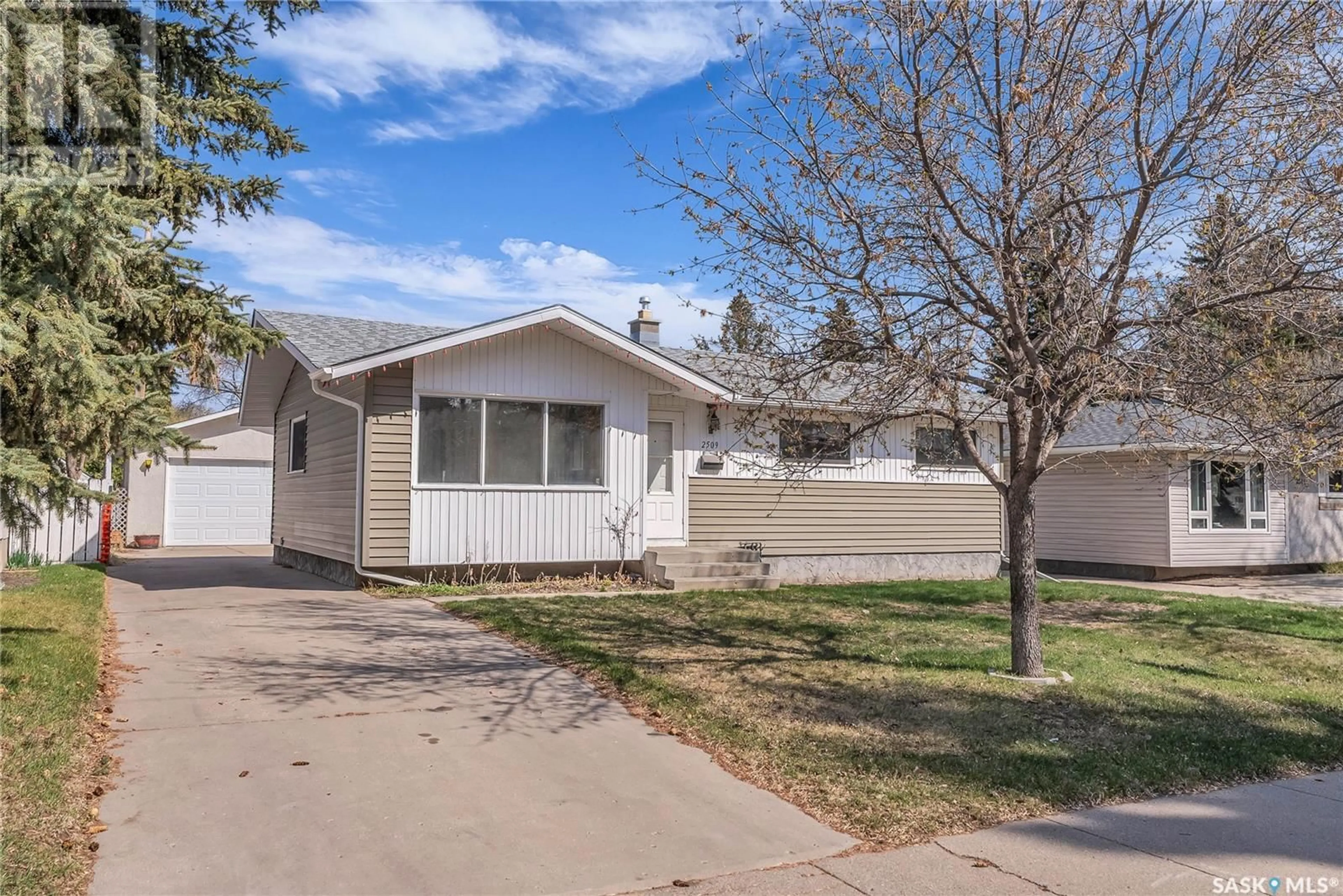 Home with vinyl exterior material, street for 2509 IRVINE AVENUE, Saskatoon Saskatchewan S7J2A9