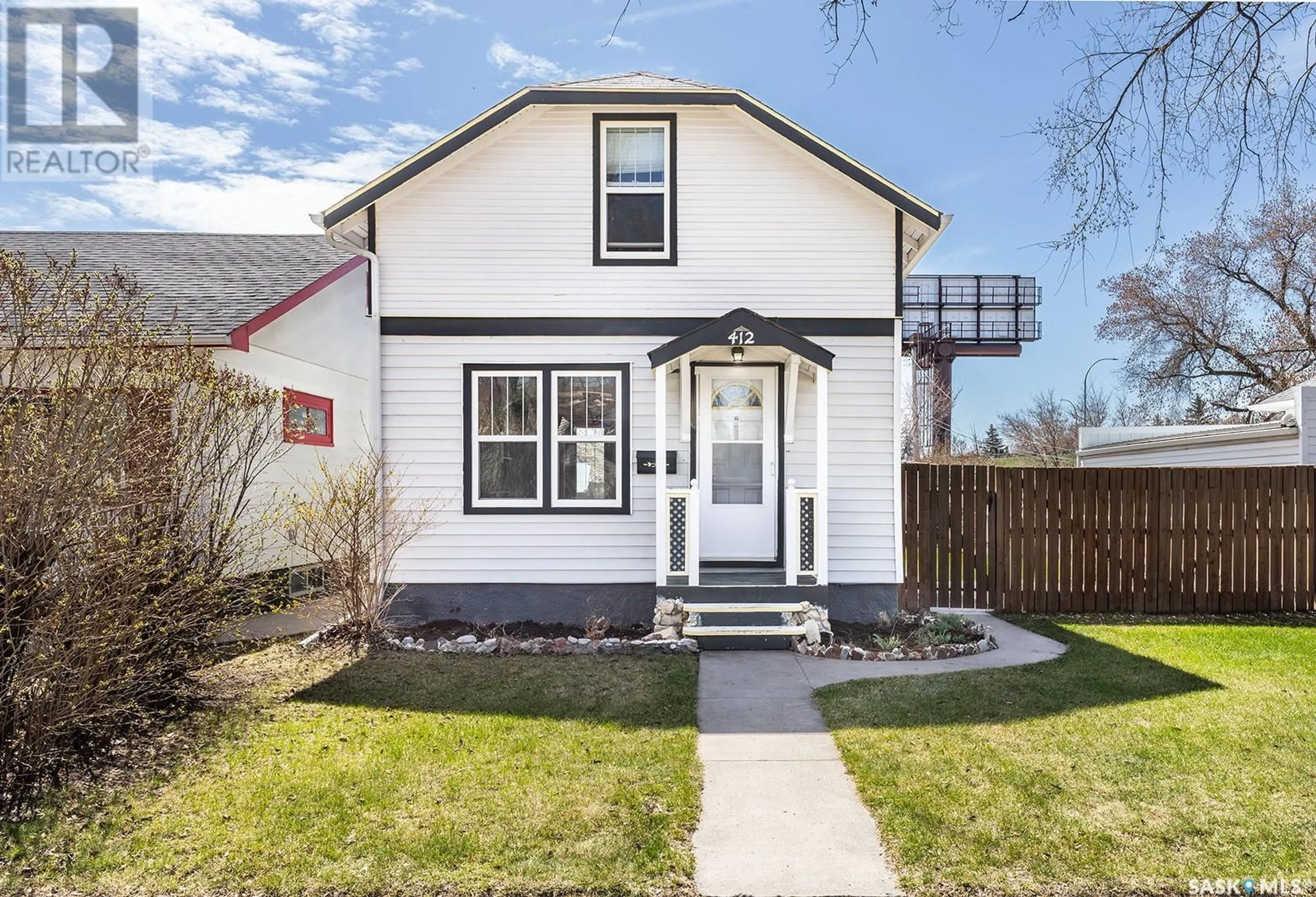 Home with vinyl exterior material, street for 412 TAYLOR STREET, Saskatoon Saskatchewan S7M0C8