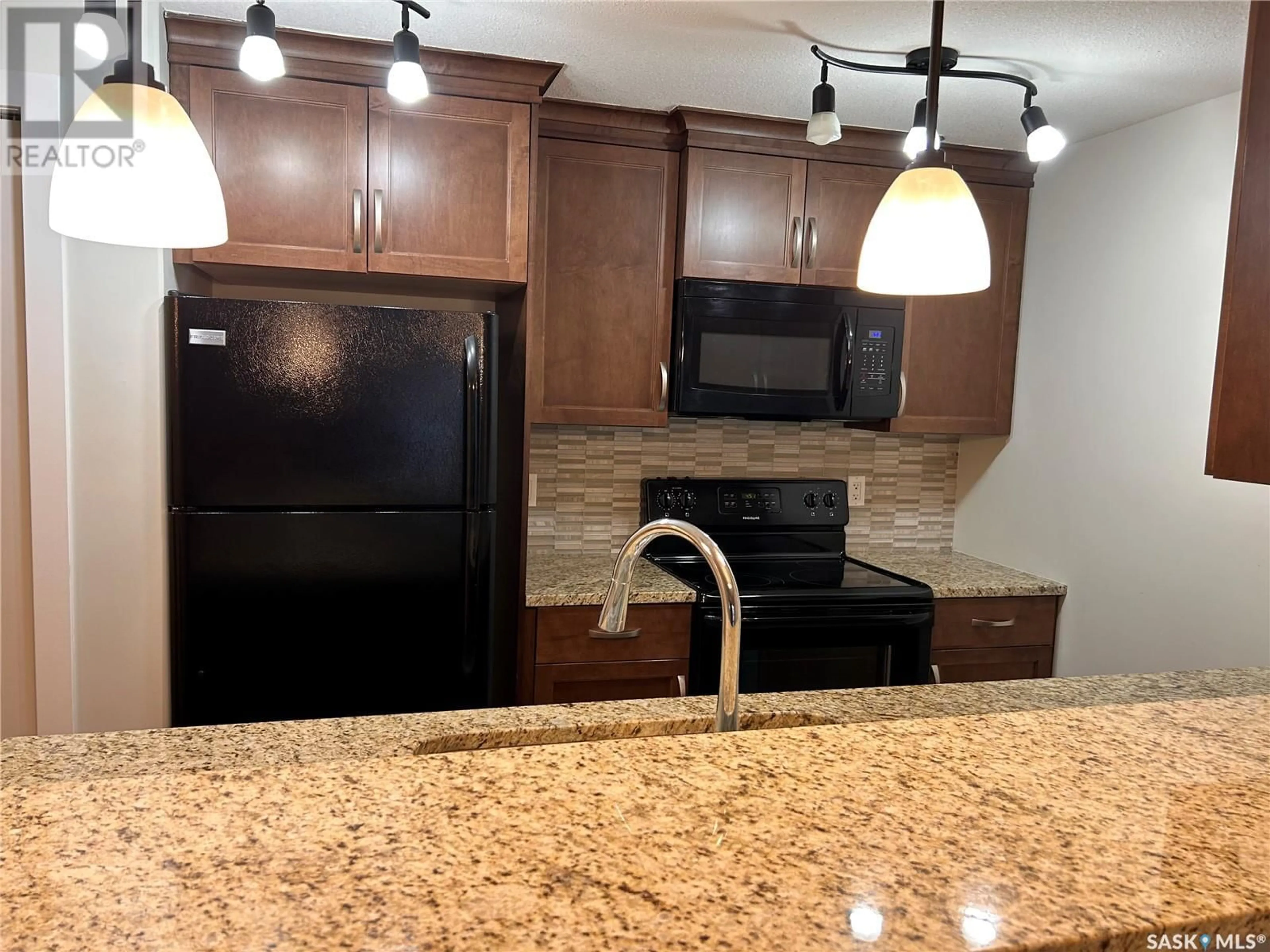 Standard kitchen, ceramic/tile floor for 102 - 1220 BLACKFOOT DRIVE, Regina Saskatchewan S4S6T2