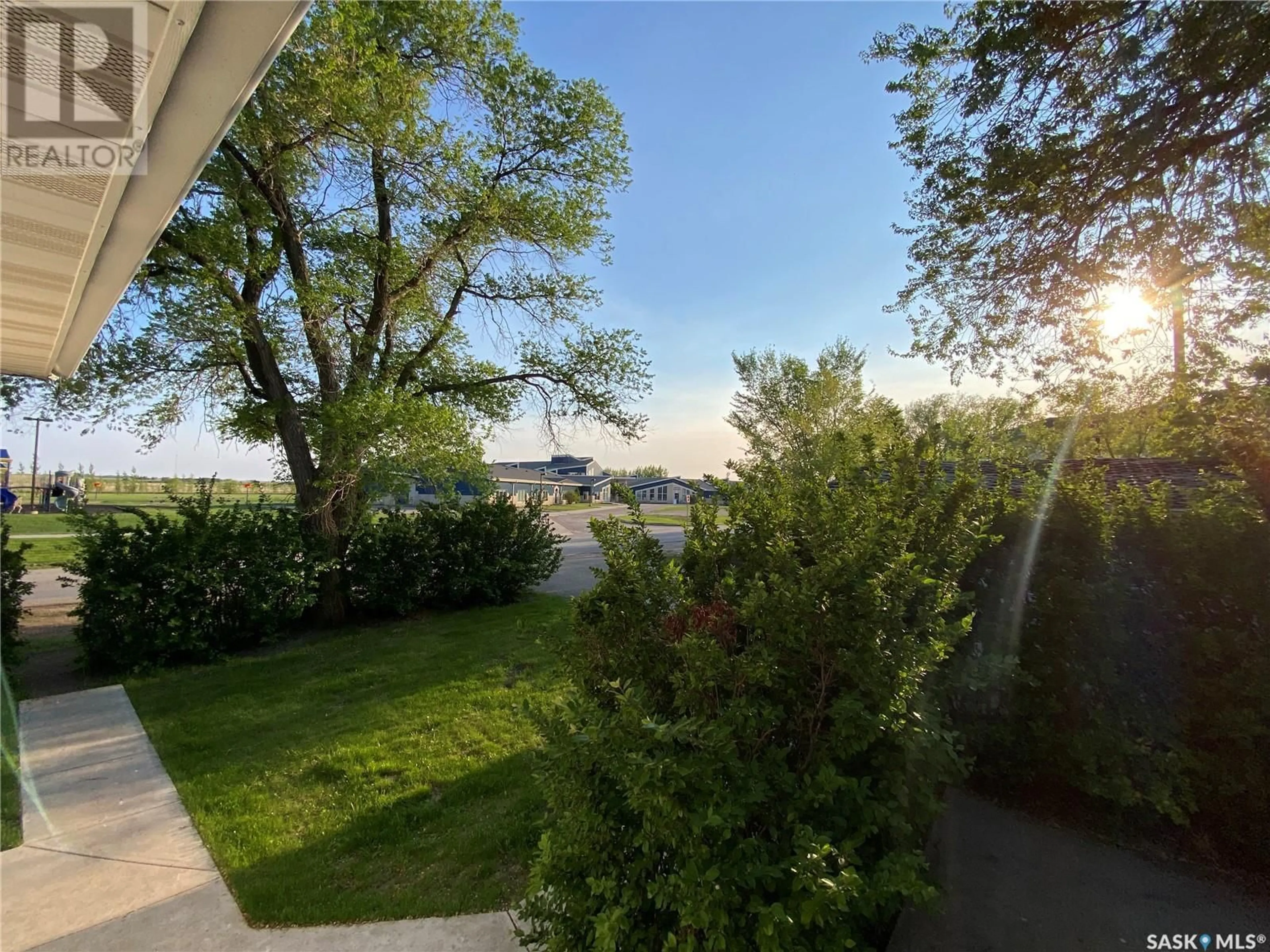 A pic from outside/outdoor area/front of a property/back of a property/a pic from drone, water/lake/river/ocean view for E - 320 2 STREET, Carnduff Saskatchewan S0C0S0