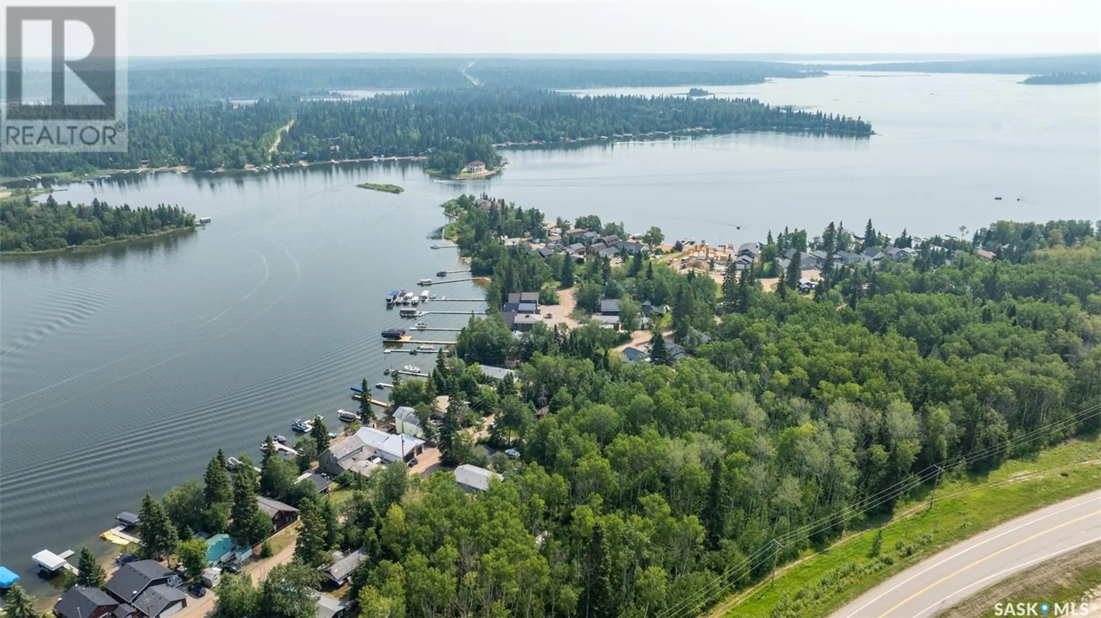 A pic from outside/outdoor area/front of a property/back of a property/a pic from drone, water/lake/river/ocean view for 201 AGNES STREET, Emma Lake Saskatchewan S0J0N0