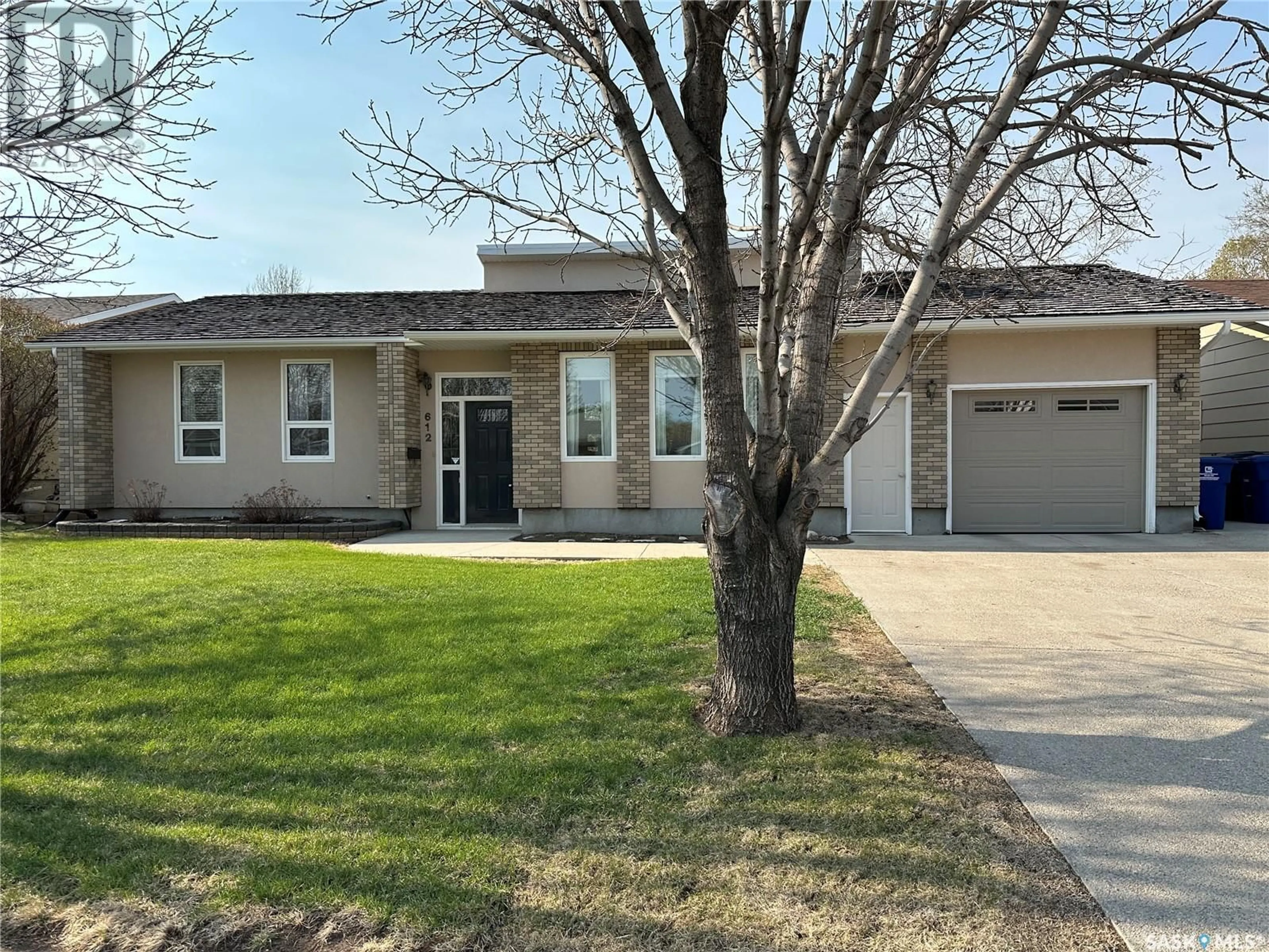 Home with vinyl exterior material, street for 612 STAVELEY CRESCENT, Weyburn Saskatchewan S4H2T6
