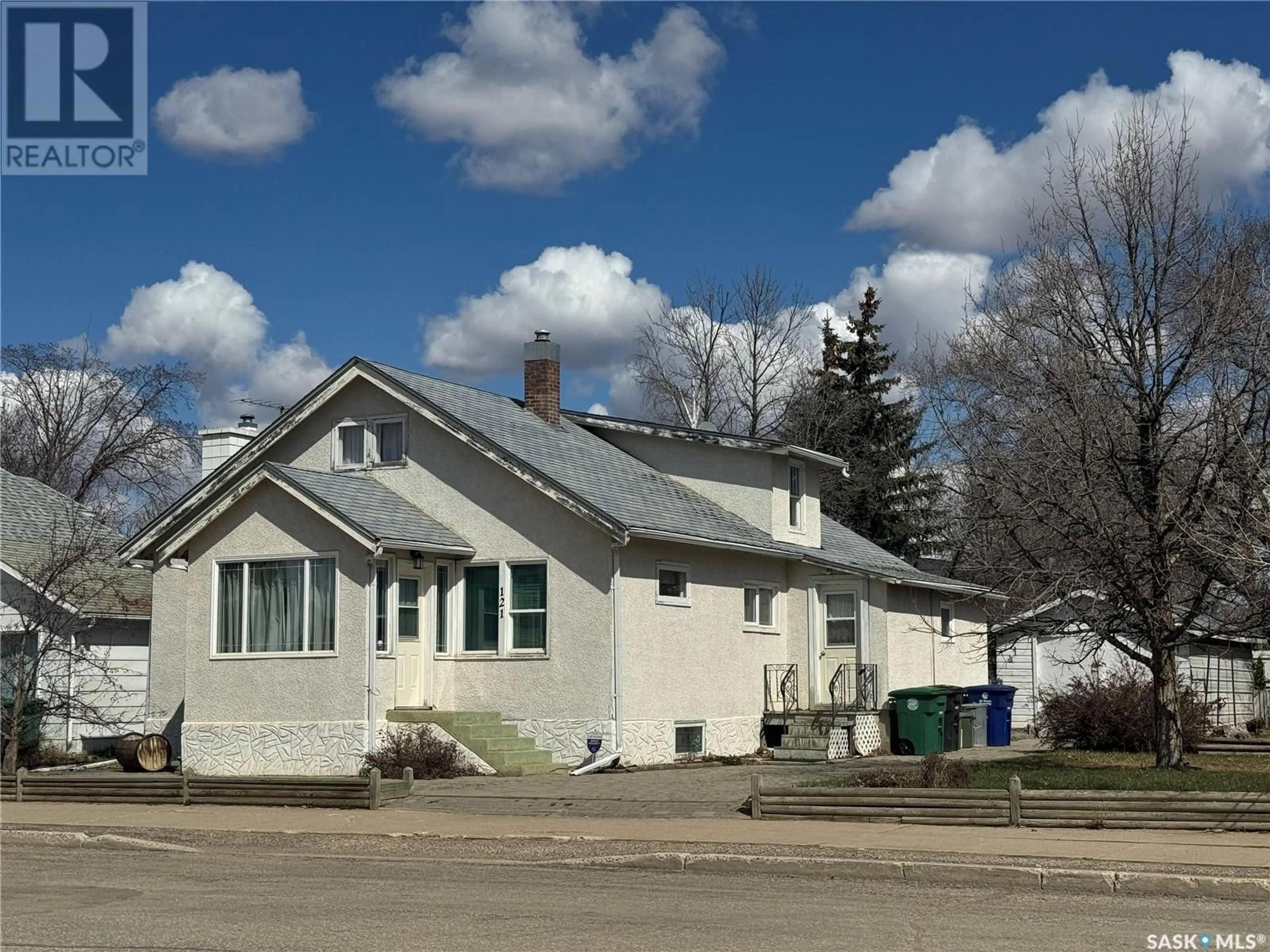 A pic from outside/outdoor area/front of a property/back of a property/a pic from drone, street for 121 2ND AVENUE, Biggar Saskatchewan S0K0M0