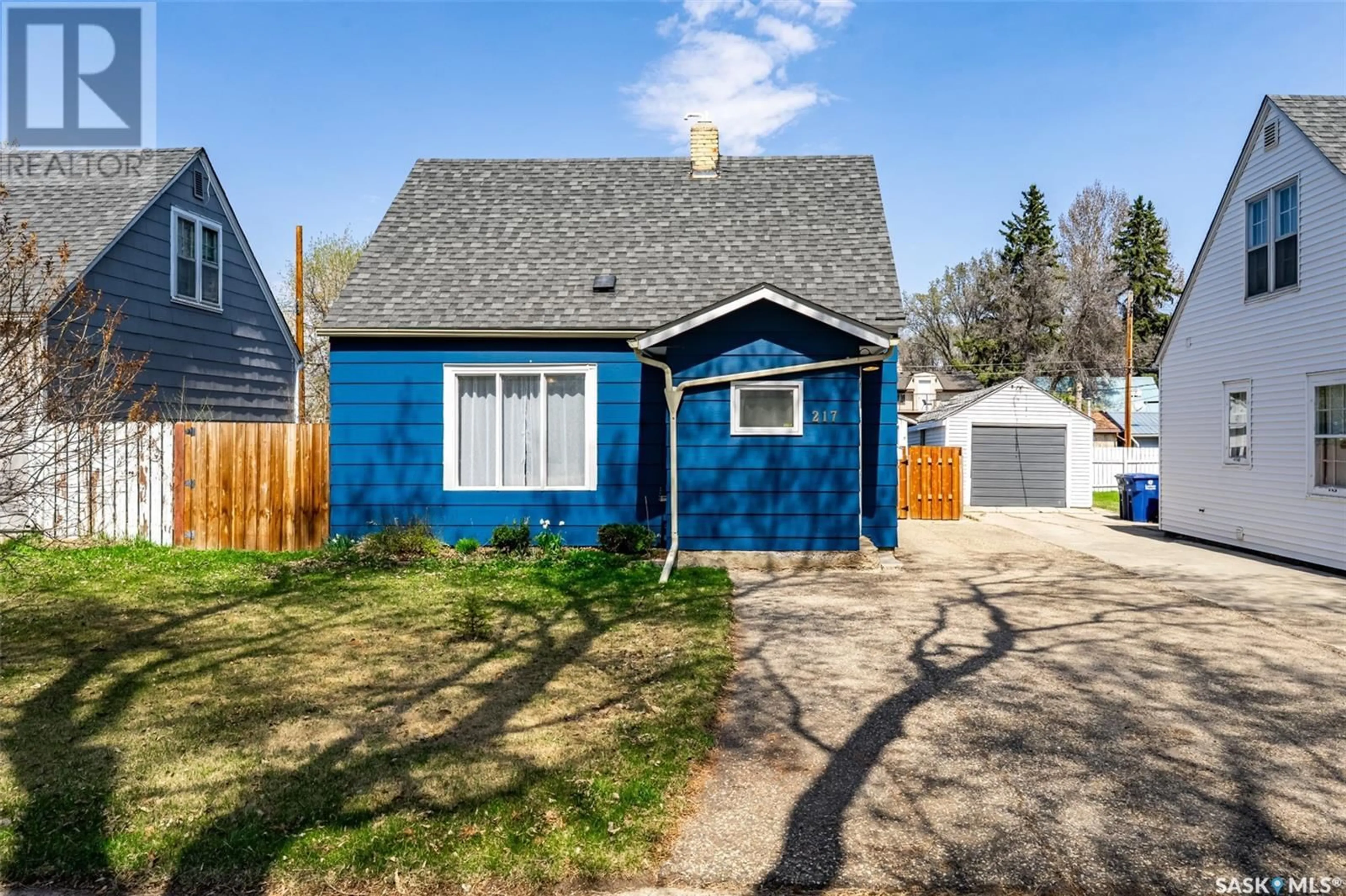Home with vinyl exterior material, street for 217 ASH STREET, Saskatoon Saskatchewan S7J0J9