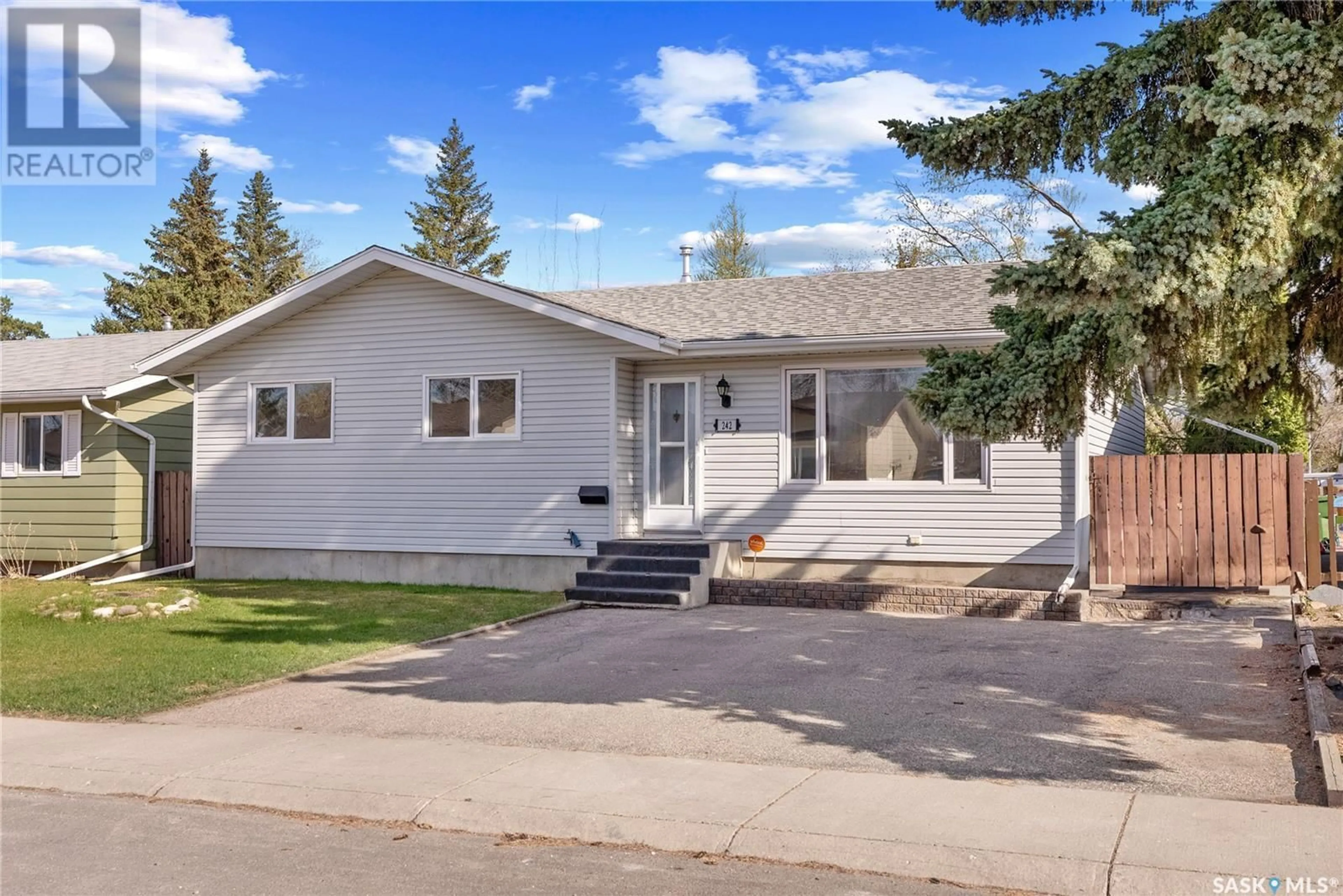 Home with vinyl exterior material, street for 242 STREB CRESCENT, Saskatoon Saskatchewan S7M4V4