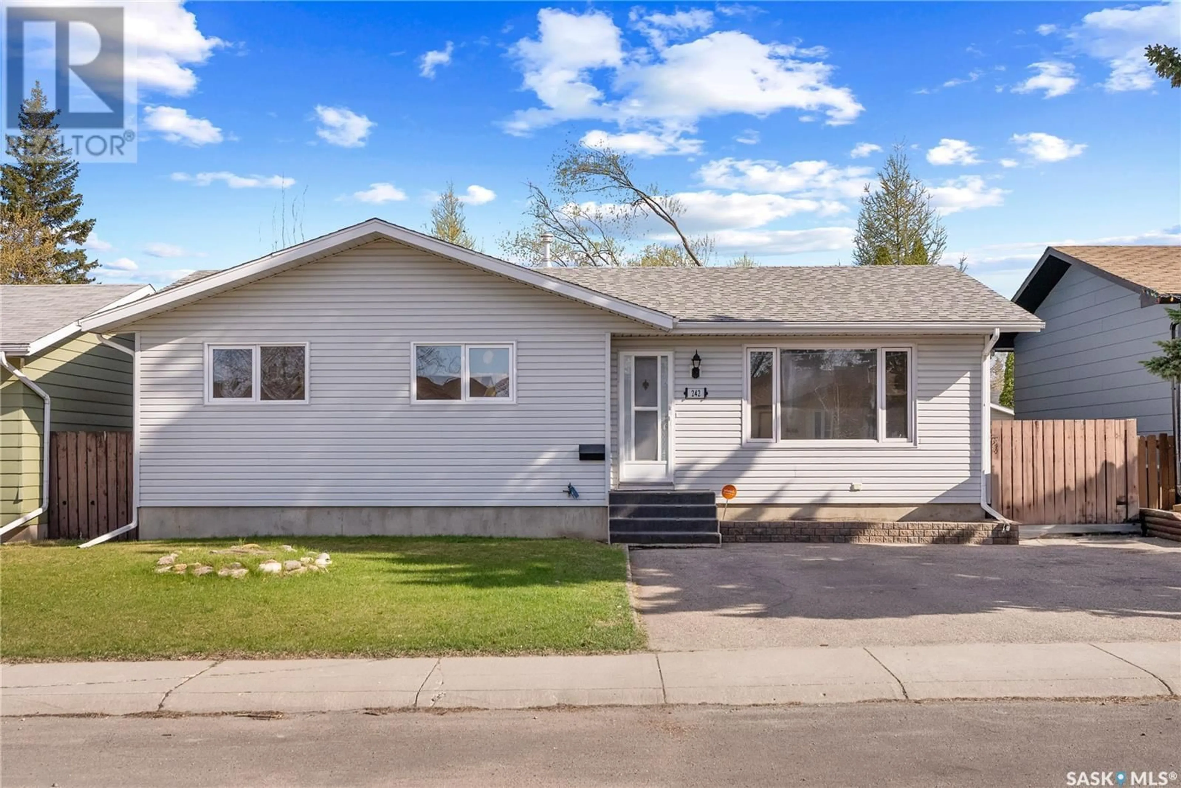 Home with vinyl exterior material, street for 242 STREB CRESCENT, Saskatoon Saskatchewan S7M4V4
