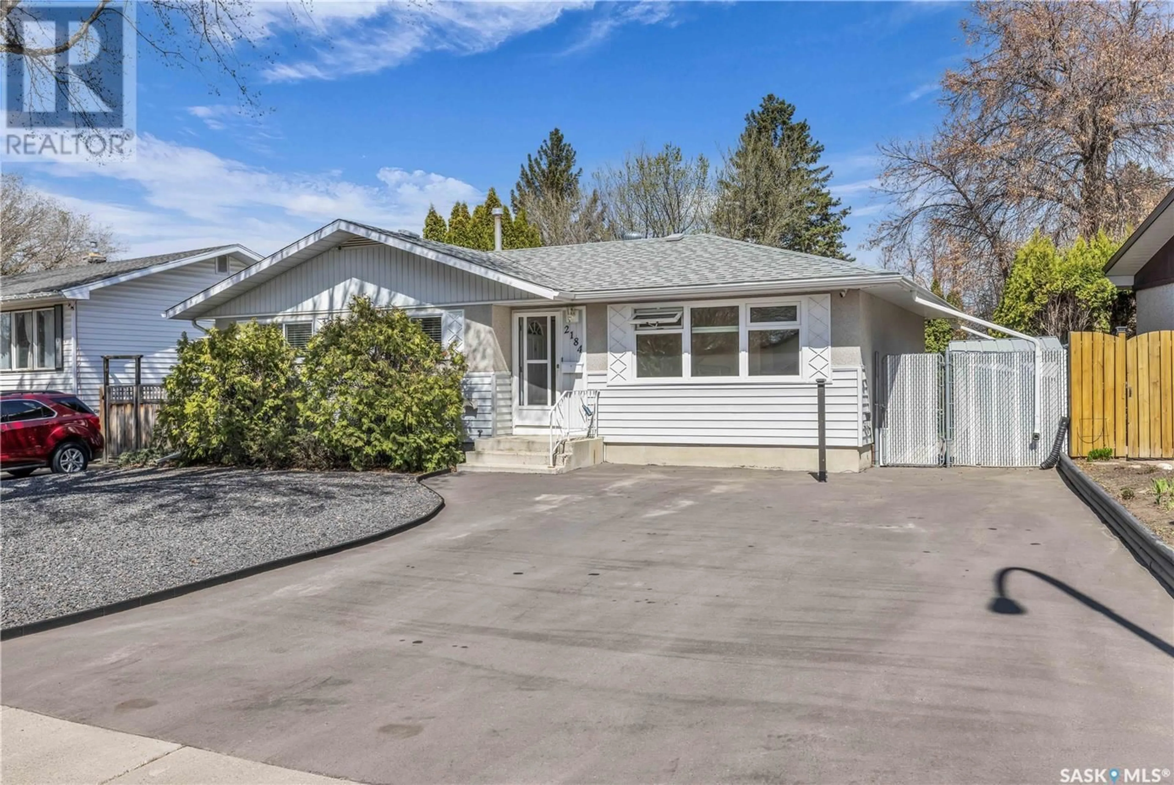 Home with vinyl exterior material, street for 2184 EASTHILL, Saskatoon Saskatchewan S7J3C9