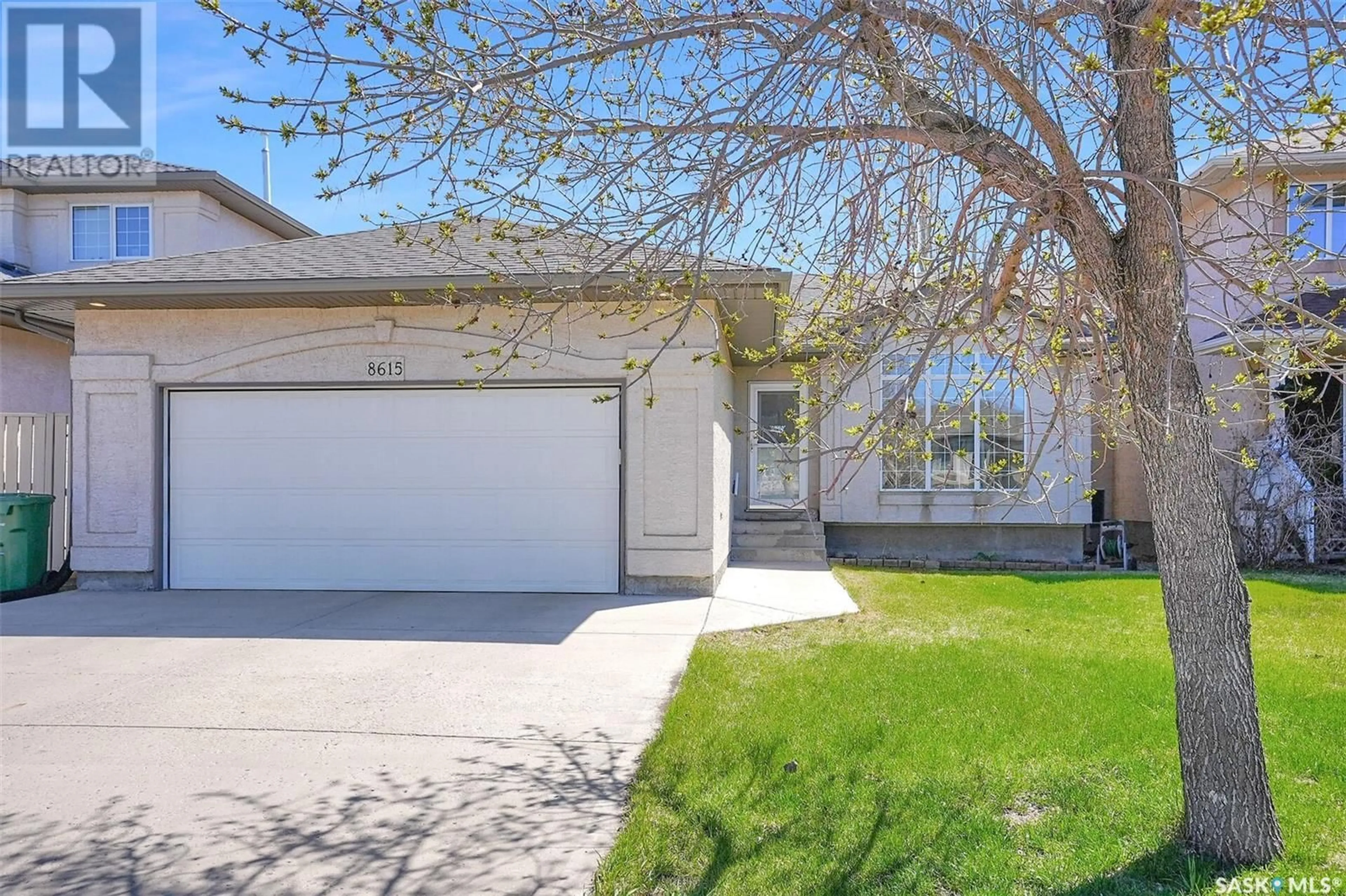 Home with vinyl exterior material, street for 8615 SHERWOOD DRIVE, Regina Saskatchewan S4Y1A5