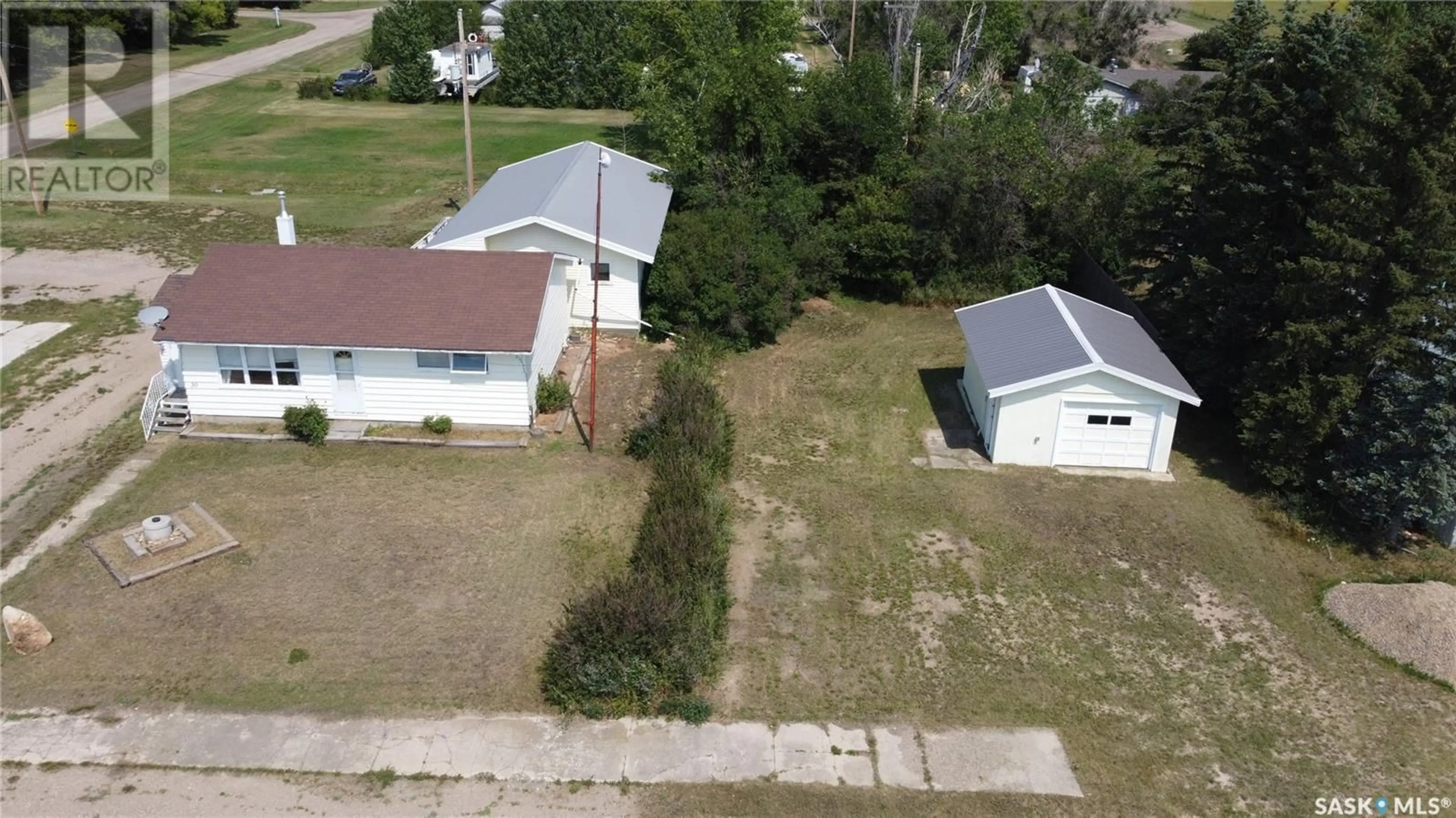 A pic from outside/outdoor area/front of a property/back of a property/a pic from drone, building for 30 RAILWAY AVENUE, Success Saskatchewan S0N2R0