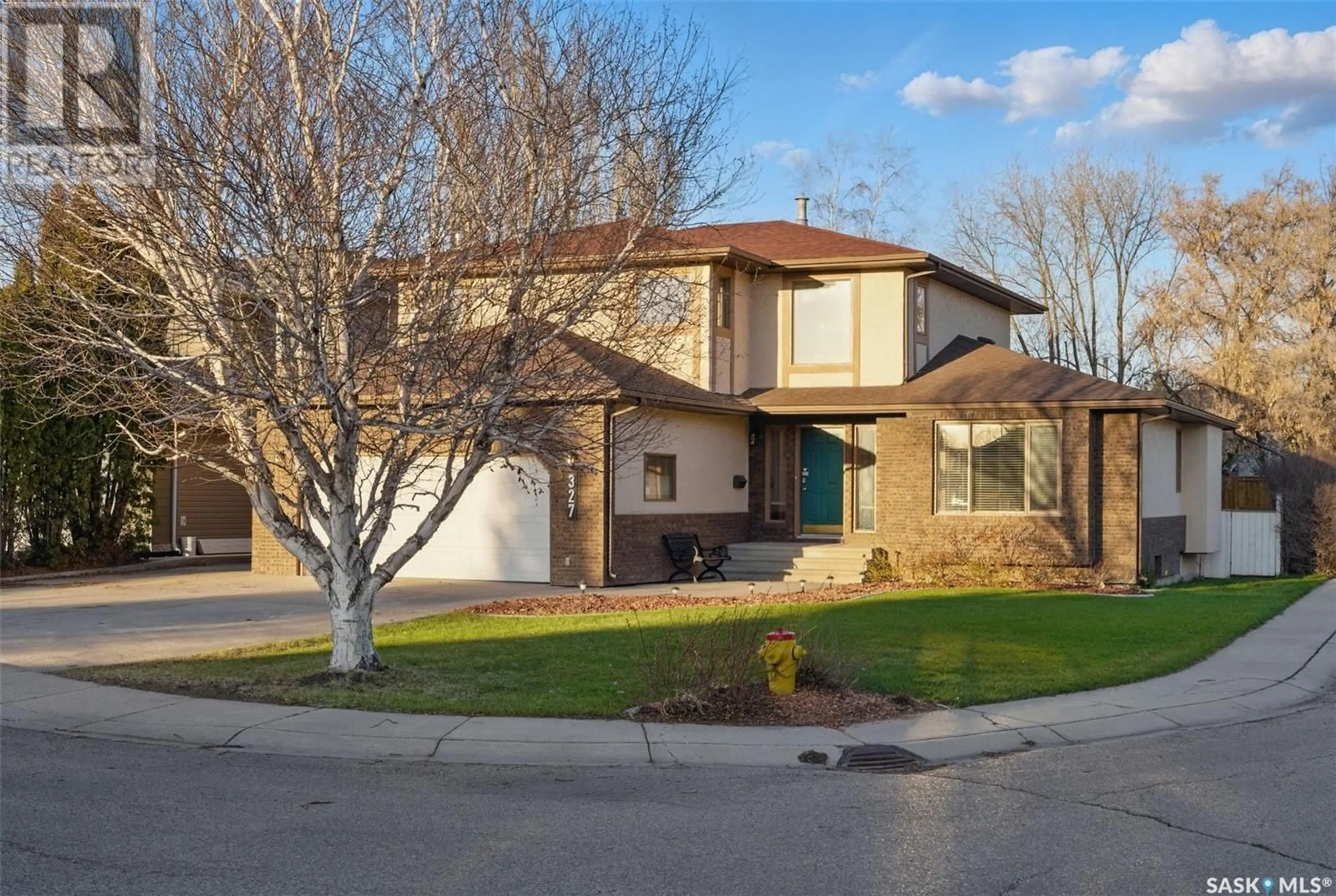 Home with brick exterior material, street for 327 BONLI PLACE, Saskatoon Saskatchewan S7N4A2