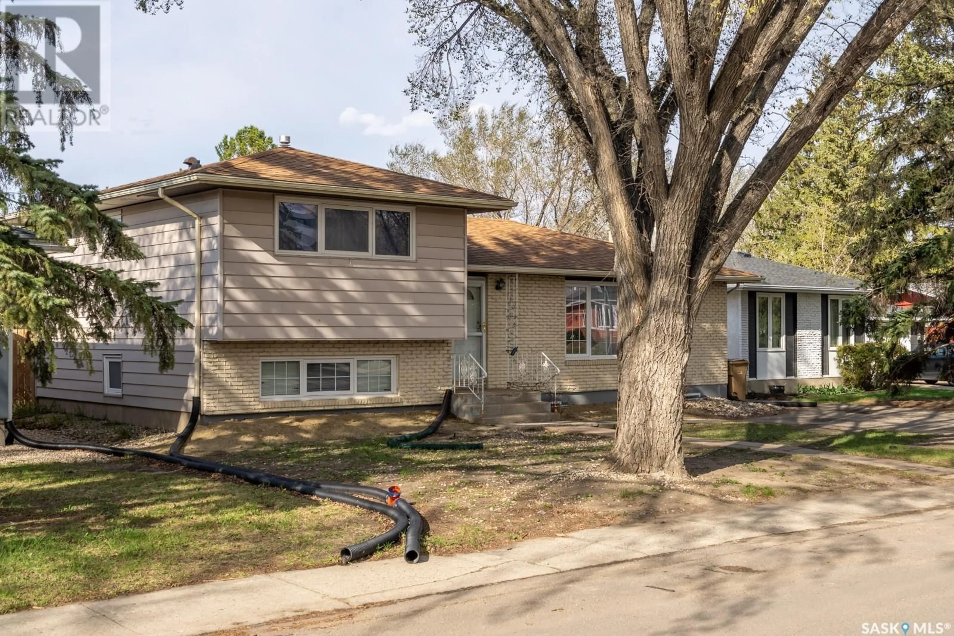 Home with vinyl exterior material, street for 30 WHEATON CRESCENT, Regina Saskatchewan S4S2Z2