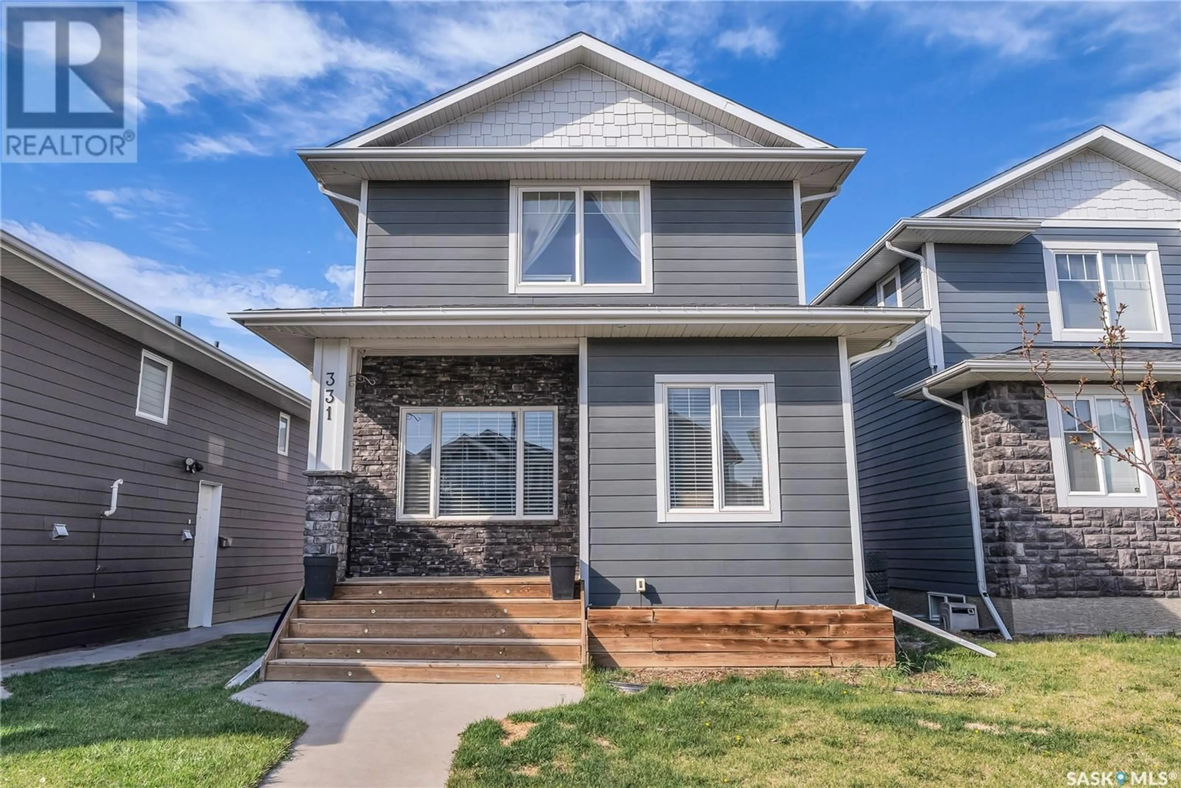Home with vinyl exterior material, street for 331 EATON LANE, Saskatoon Saskatchewan S7V0H4