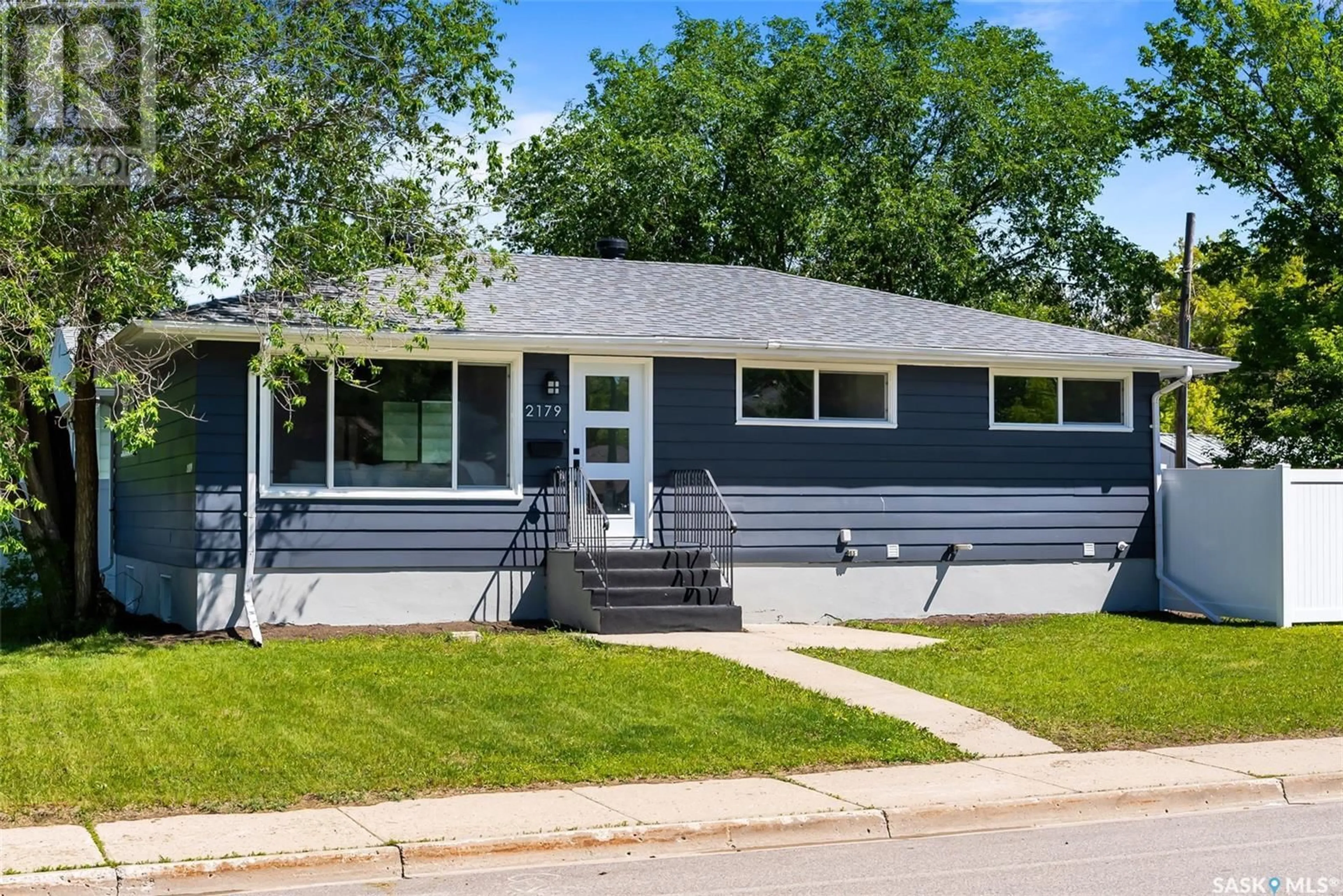 Home with vinyl exterior material, street for 2179 PASQUA STREET, Regina Saskatchewan S4T4M3