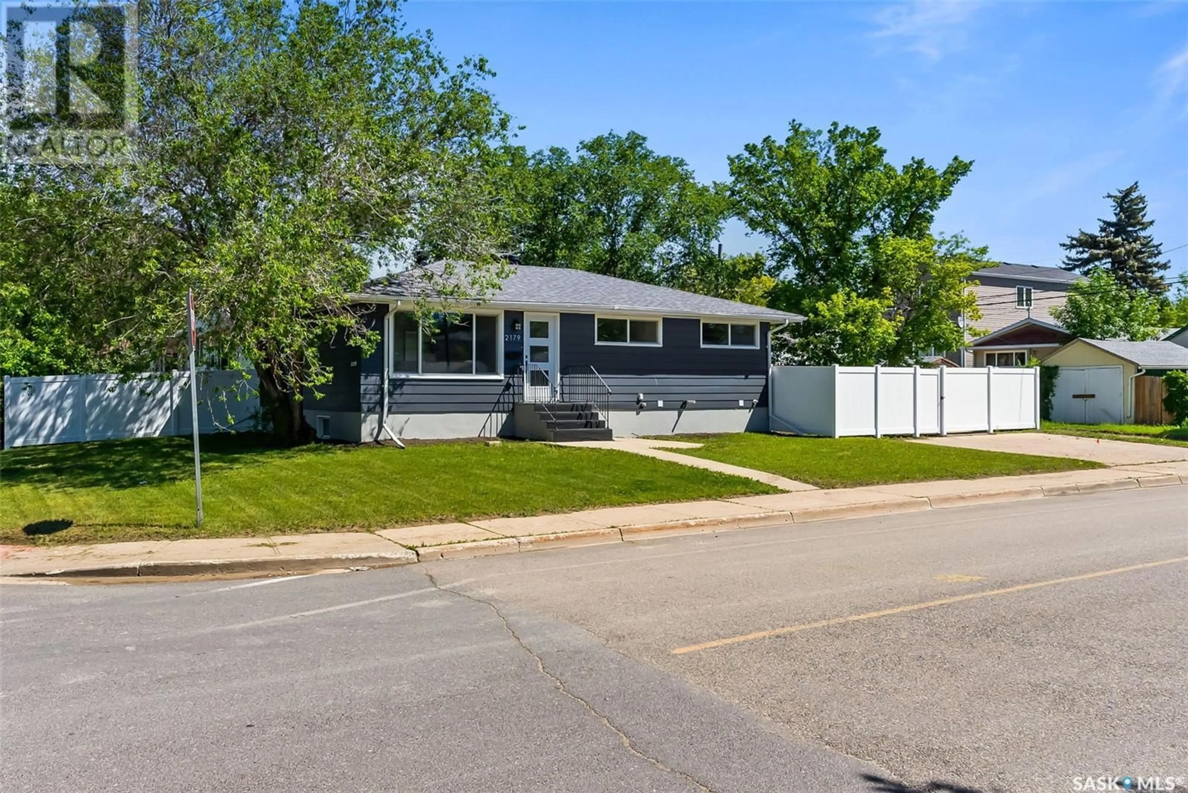 Home with vinyl exterior material, street for 2179 PASQUA STREET, Regina Saskatchewan S4T4M3