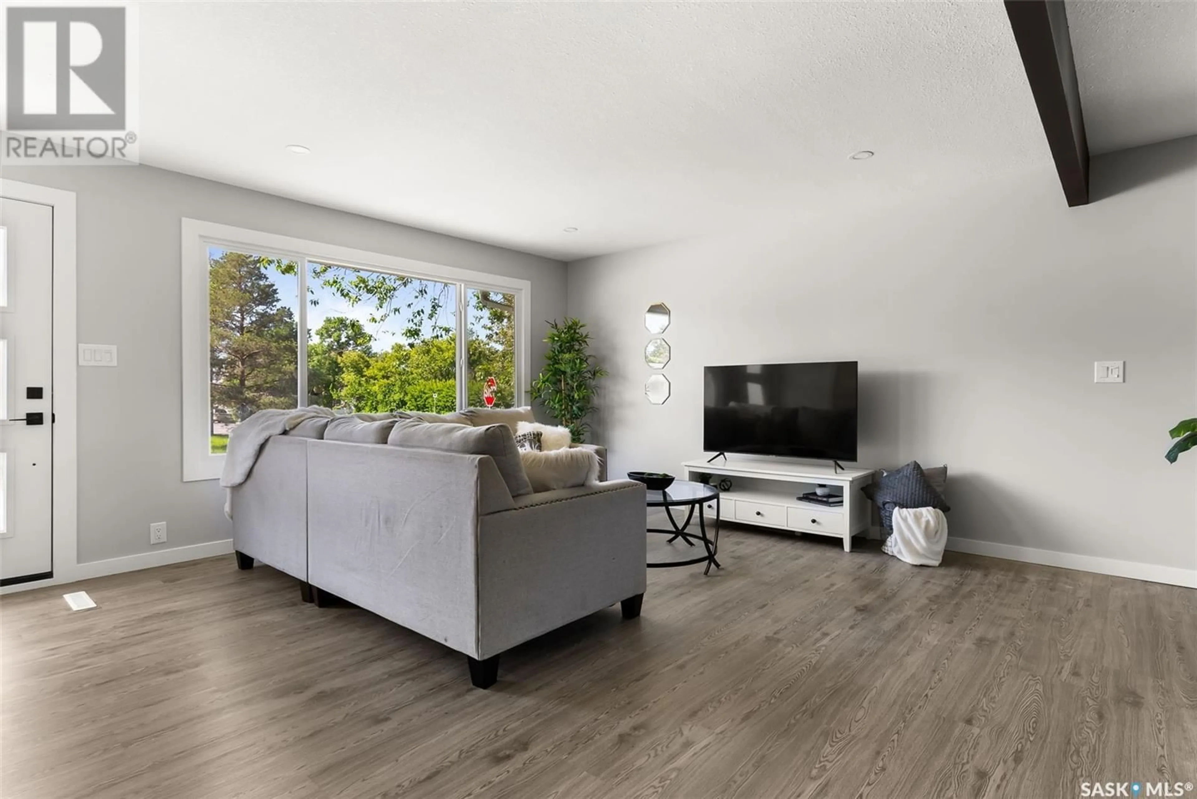 Living room with furniture, wood/laminate floor for 2179 PASQUA STREET, Regina Saskatchewan S4T4M3