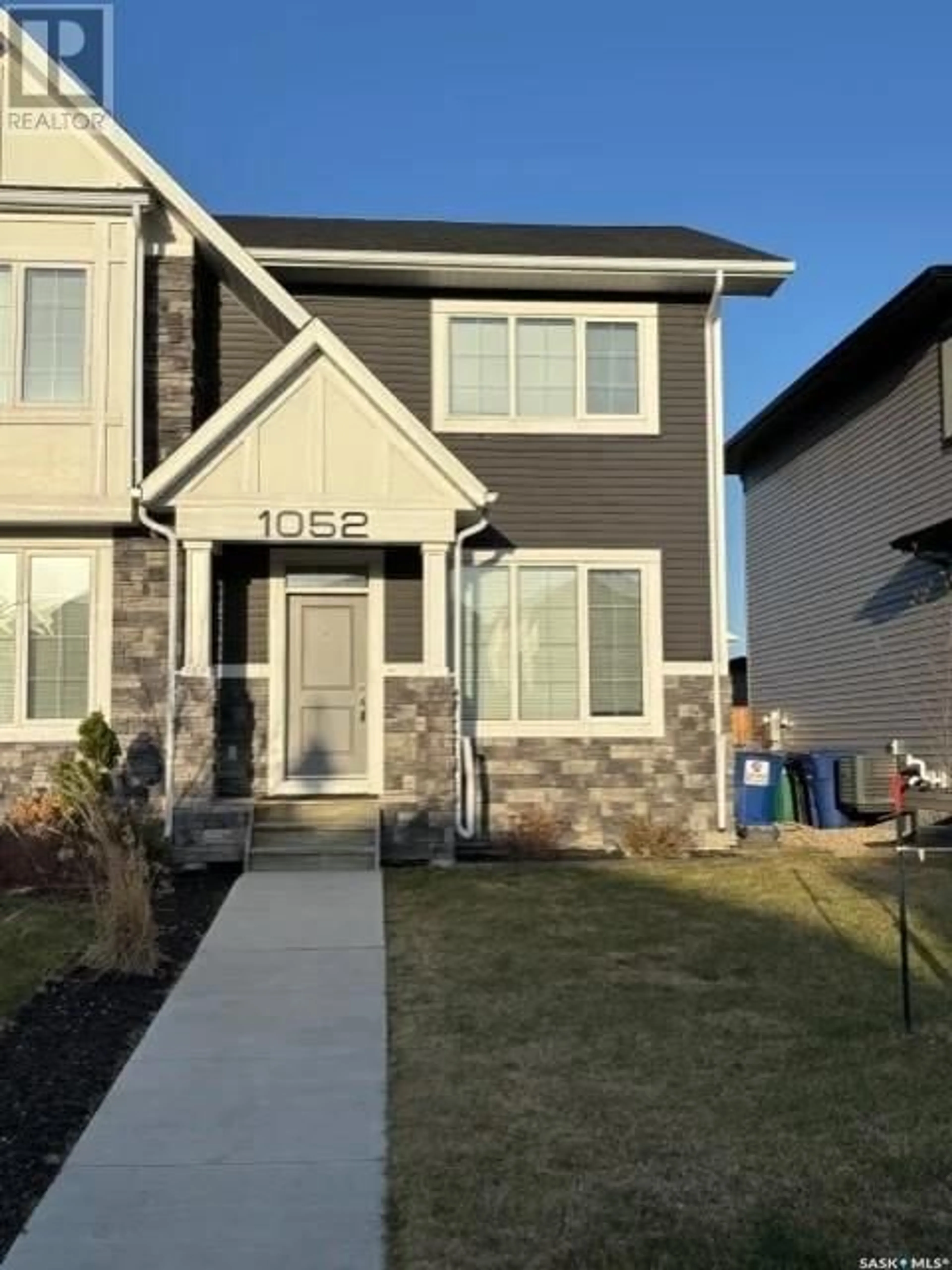 Home with vinyl exterior material, street for 1052 KOLYNCHUK CRESCENT, Saskatoon Saskatchewan S7T0X4