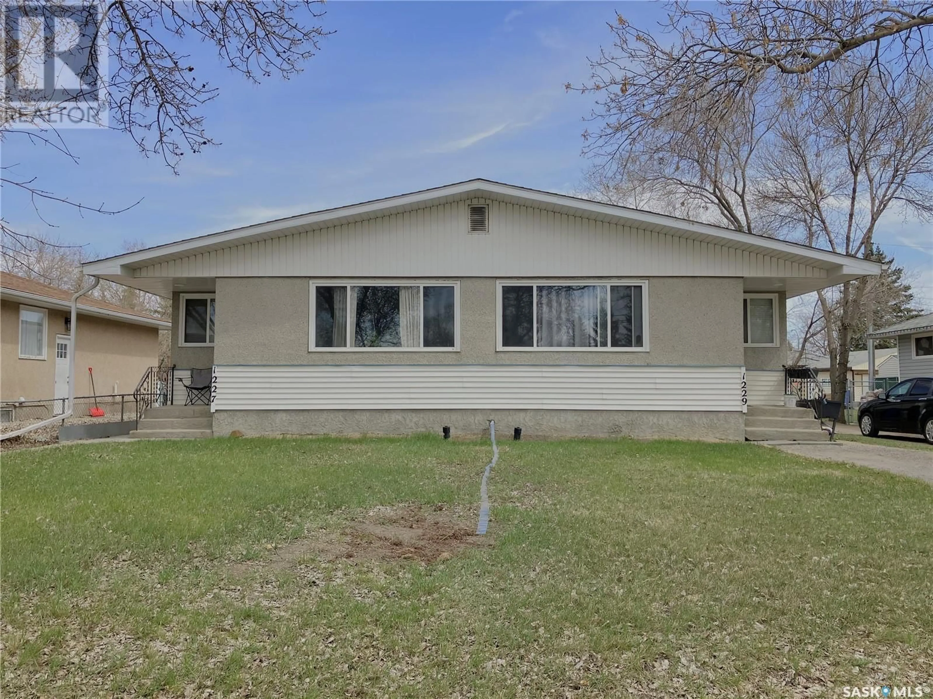 Home with vinyl exterior material, street for 1227 - 1229 BOND STREET, Regina Saskatchewan S4N1W8
