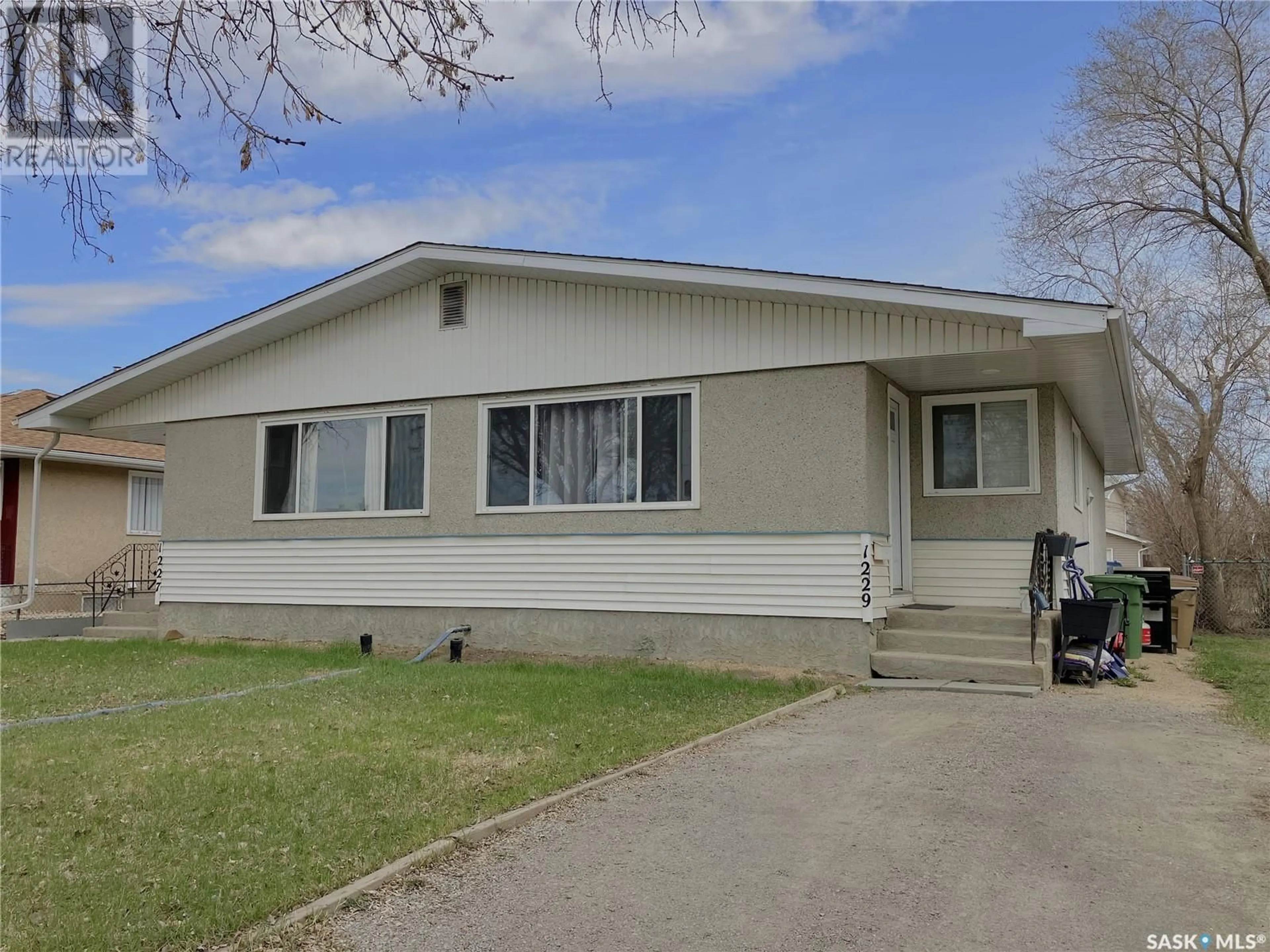 Home with vinyl exterior material, street for 1227 - 1229 BOND STREET, Regina Saskatchewan S4N1W8